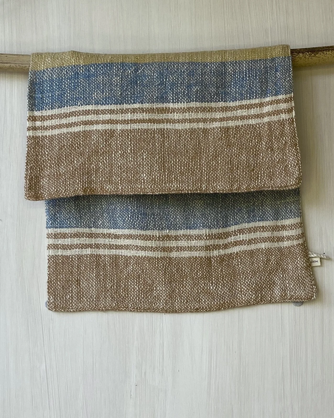 Hand Towel hanging on rod Indigo, Marigold, Cinnamon Loom Designs.jpg