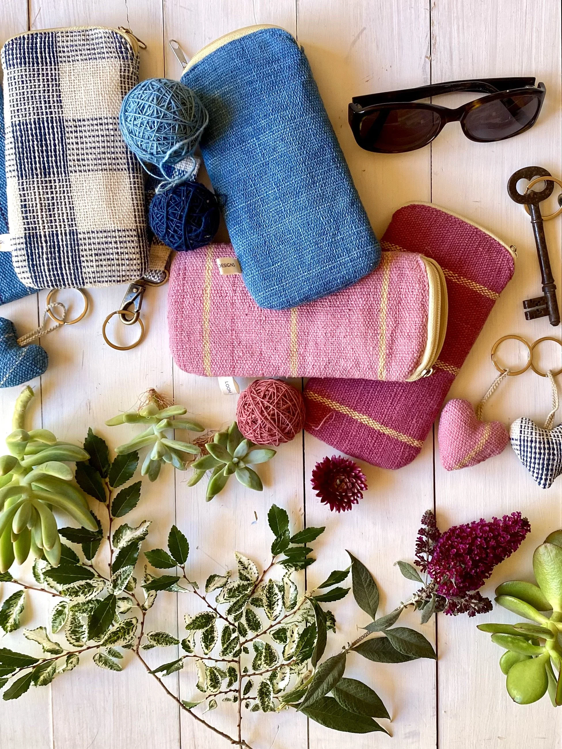 Glasses cases, key rings, with plants on board in shades of pink and blue cotton textiles by LOOM Designs.jpeg
