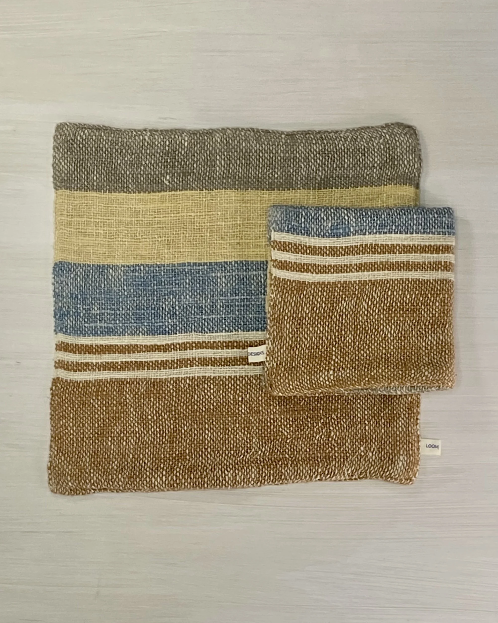 Face Washer Retro Indigo Marigold Cinnamon folded on flatlay Loom Designs.jpg