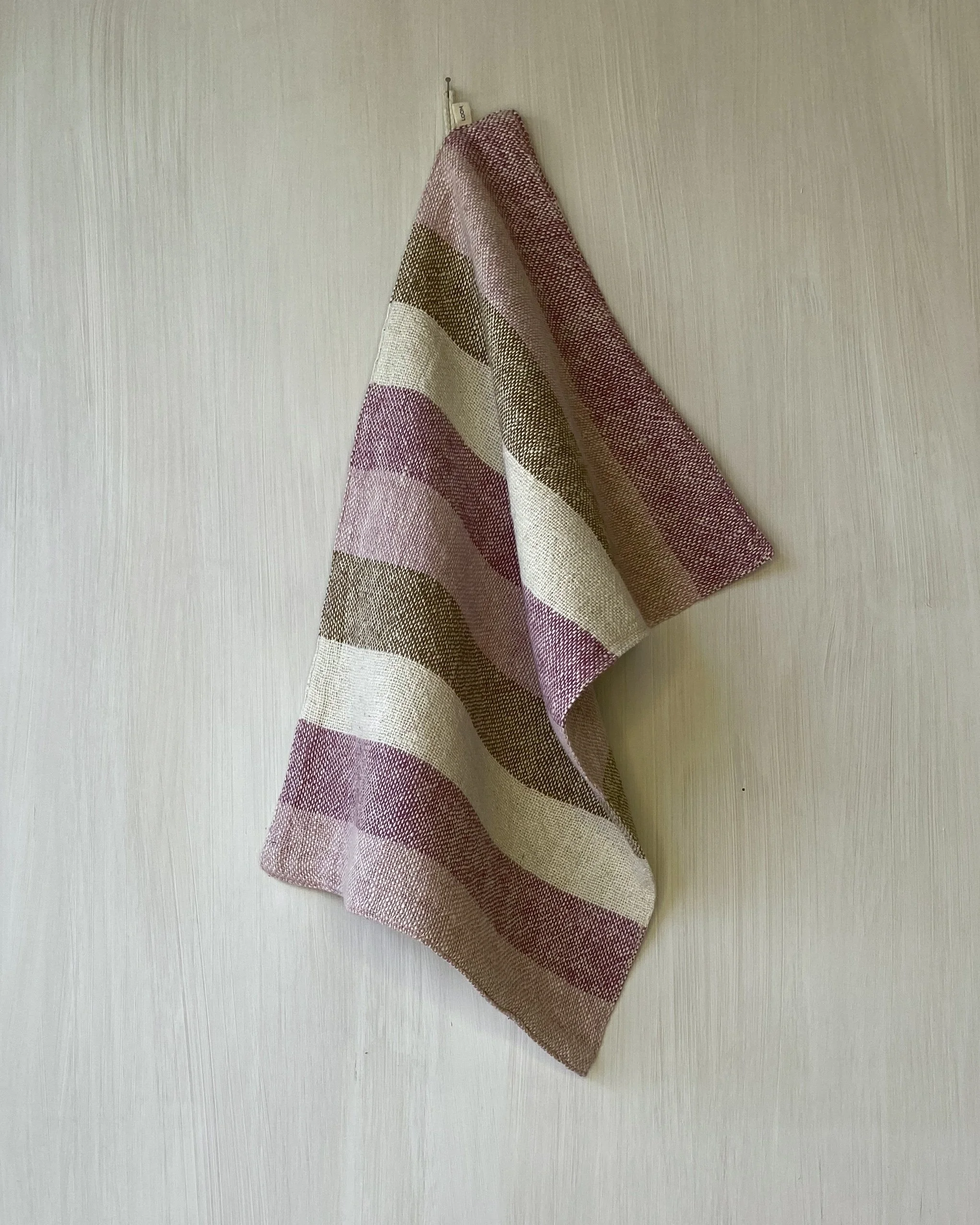 Hand Towel Pink, Marigold, Cinnamon Stripe  draped from hanging loop Loom Designs.jpg