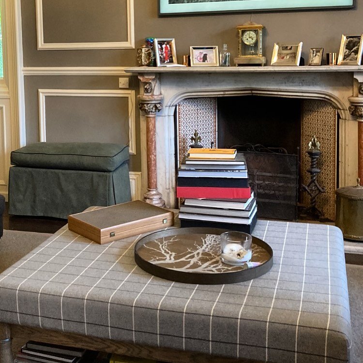 Two upholstery pieces looking fabulous in this drawing room! The media unit is upholstered in @clothshoplondon denim with contrast piping, with an added box seat feather cushion so is now a ottoman hiding all the tv controls! Also large tartan ottoma