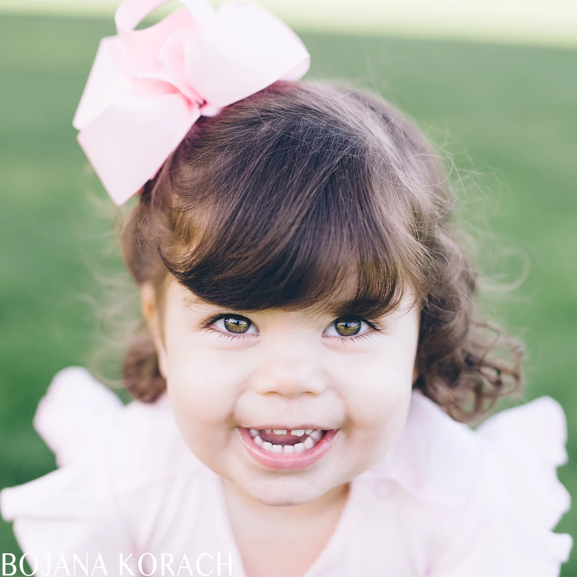 portrait of a child smiling and looking at the camera