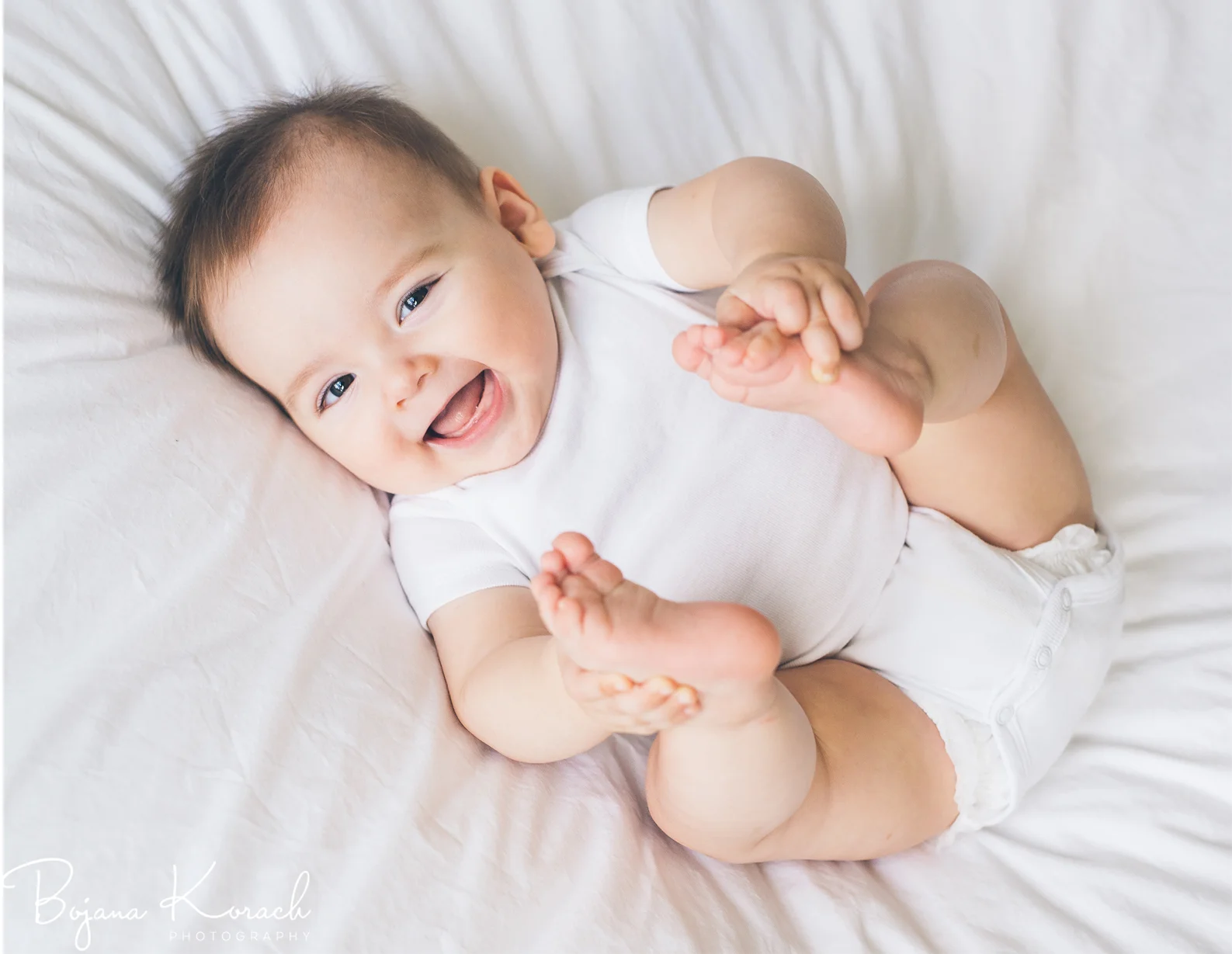smiling six month old boy