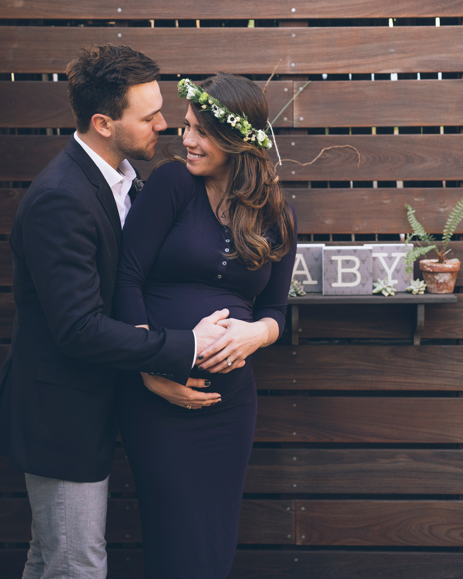 husband-and-wife-looking-at-each-other-lovingly-during-maternity-session-in-oakland.jpg