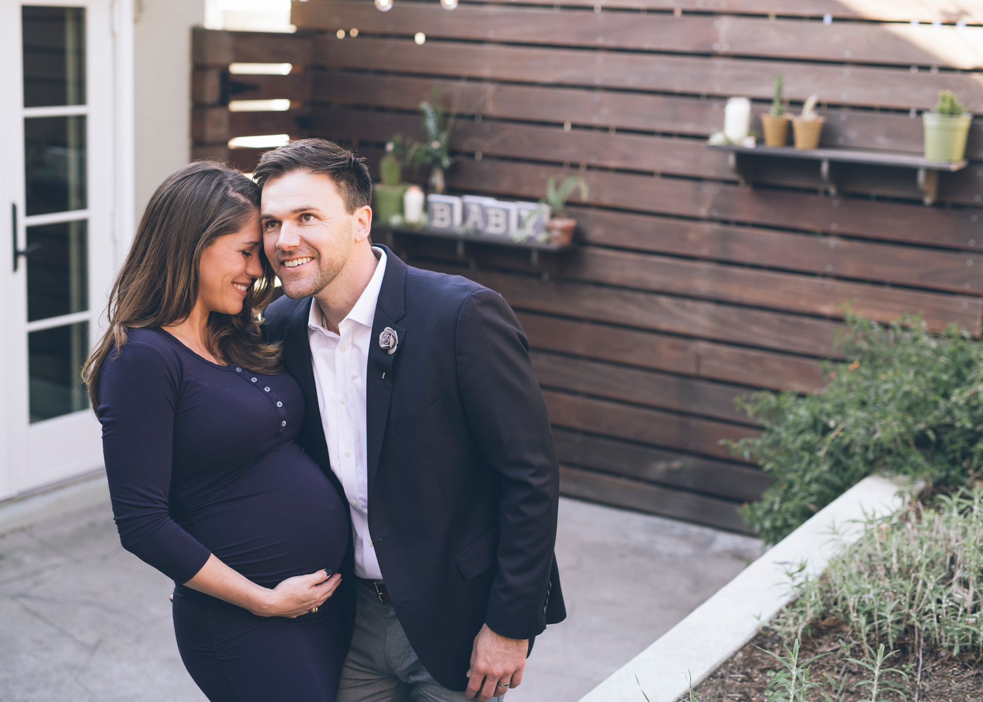 expectant-couple-hugging-during-maternity-session.jpg