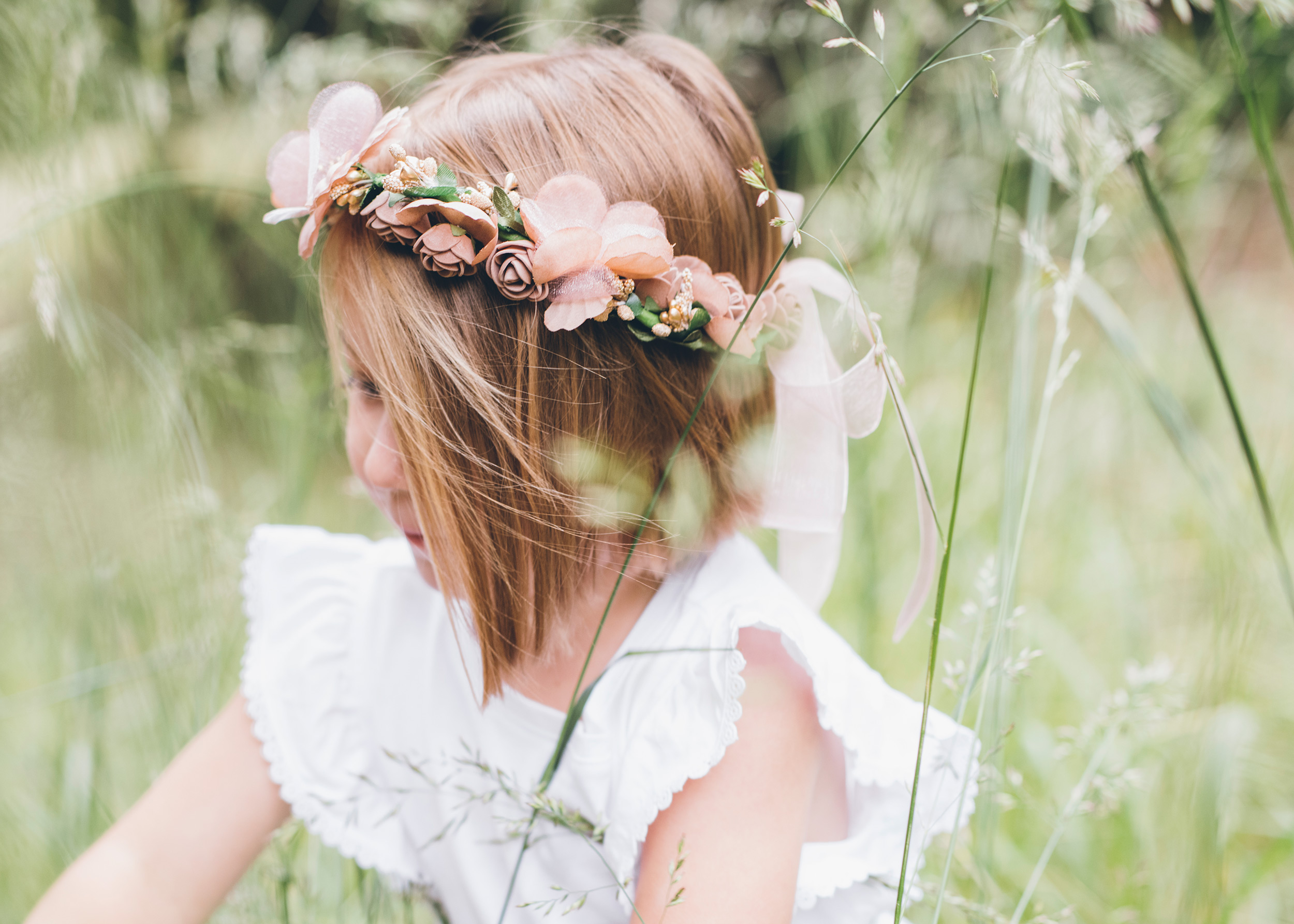 flower-girl-photographed-through-tall-grass.jpg