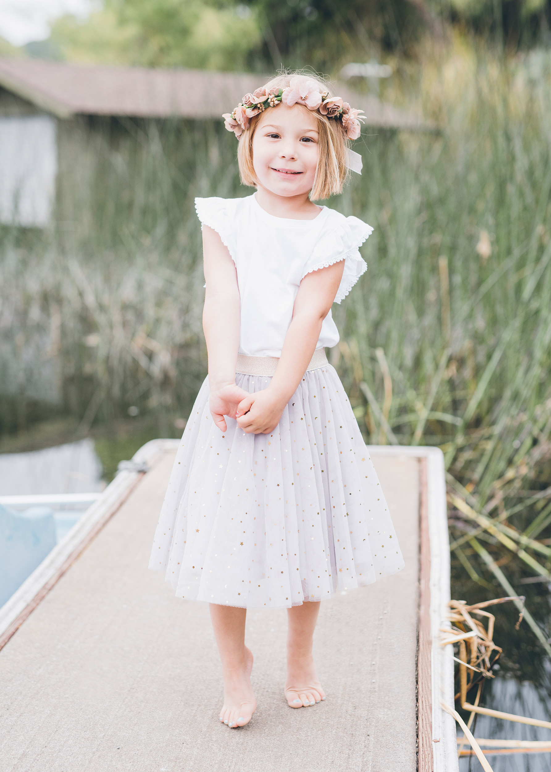 beautiful-four-year-old-girl-standing-on-the-dock.jpg