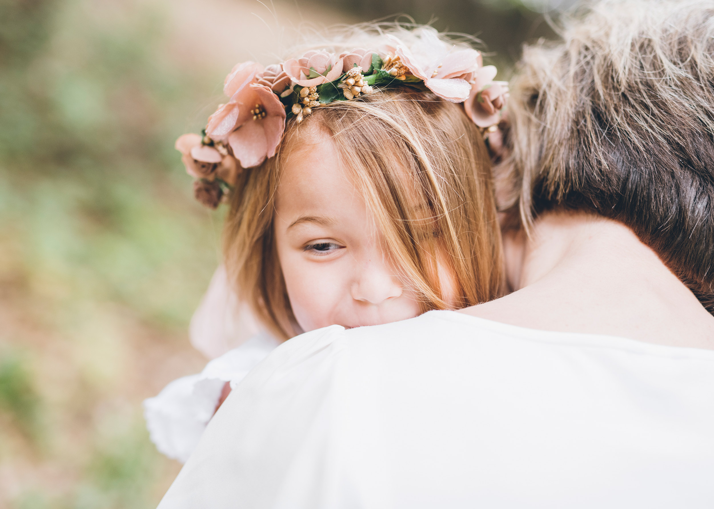 daugher-smiling-and-leaning-on-her-mother's-shoulder.jpg