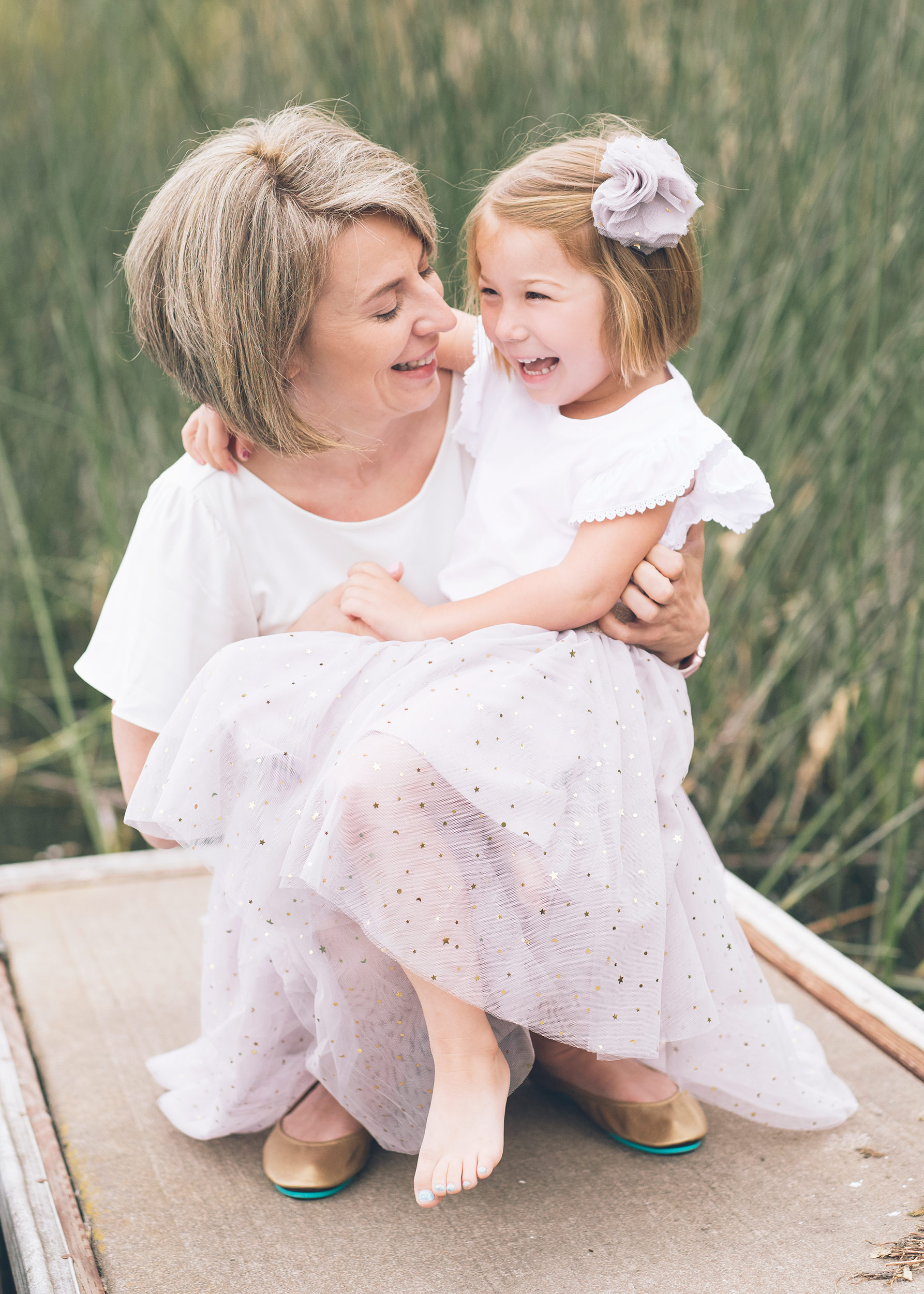 daughter-and-mother-laughing-during-lifestyle-portrait-session.jpg