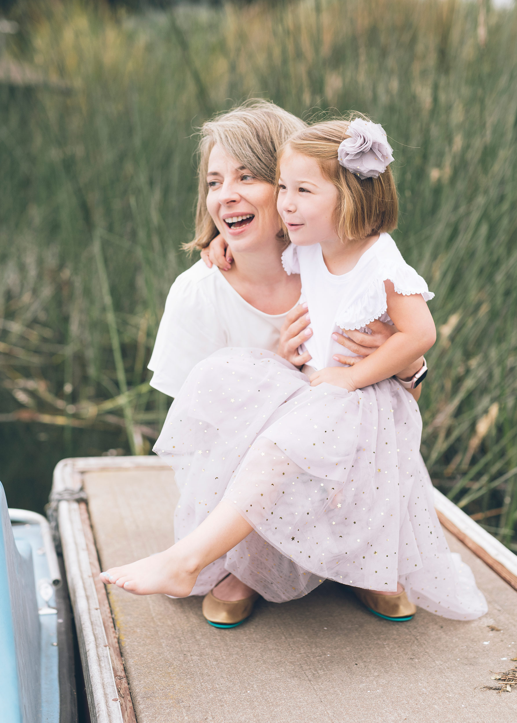 mother-holding-her-daughter-and-looking-away.jpg