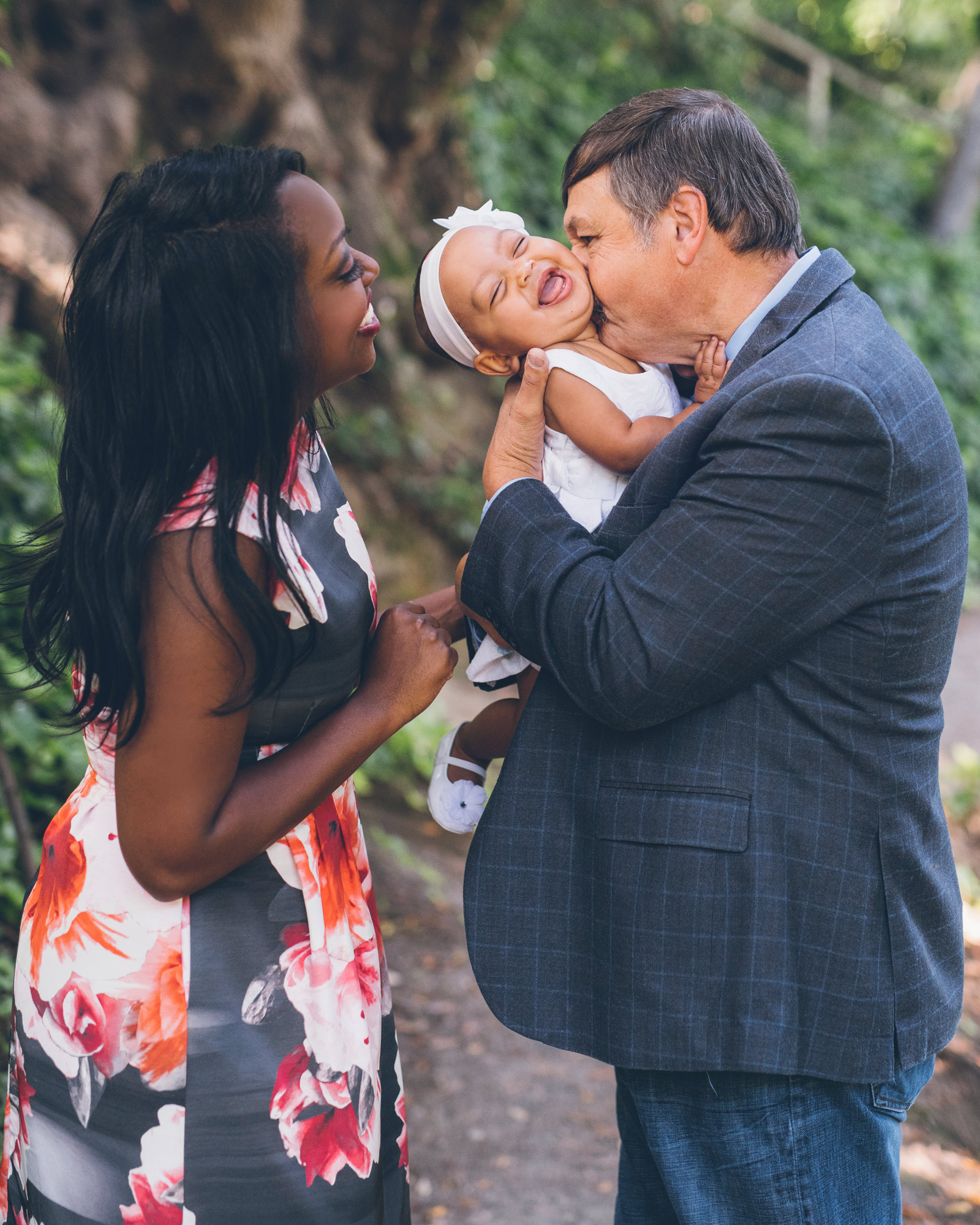 portrait-of-a-one-year-old-baby-girl-with-her-parents.jpg