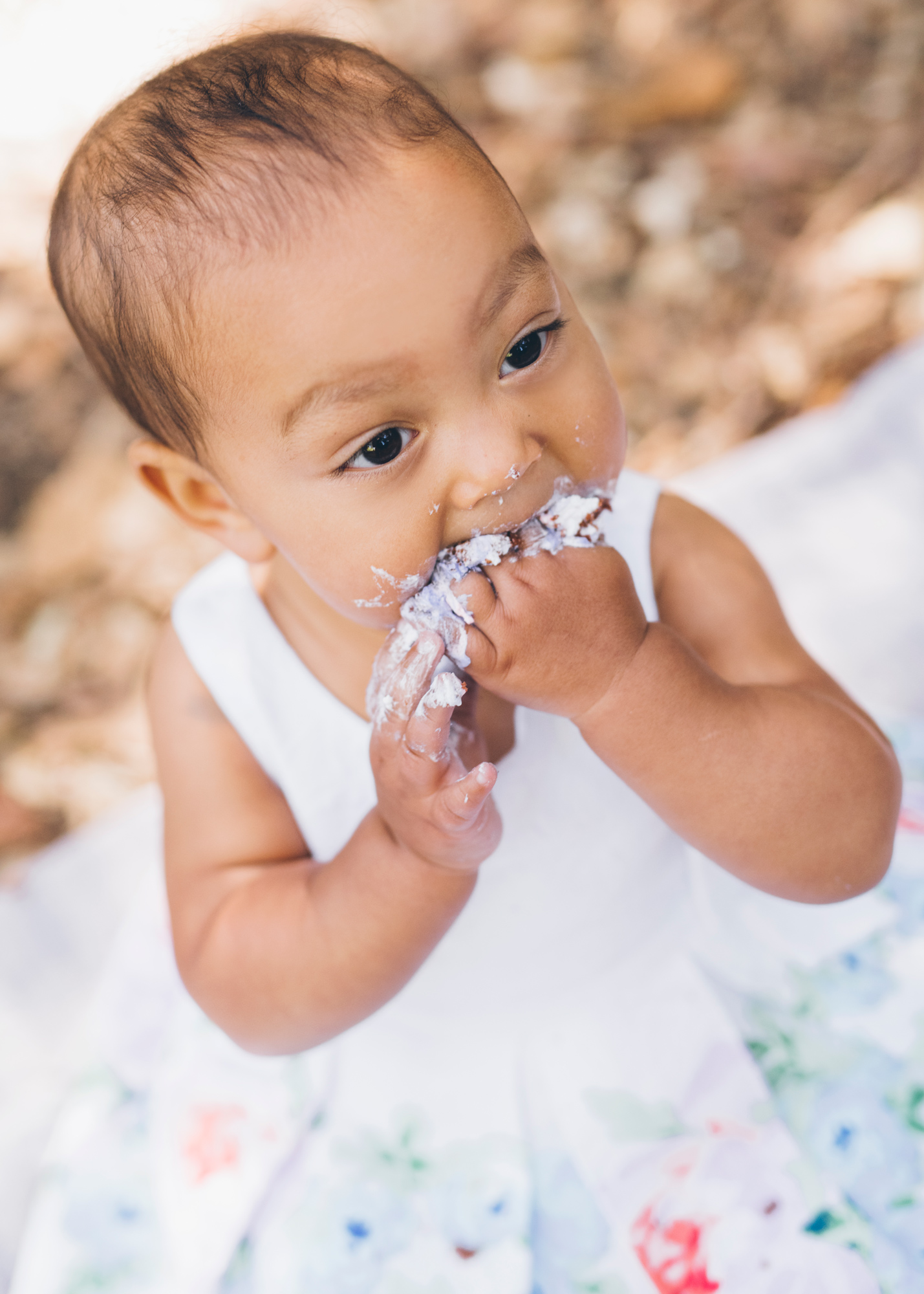 baby-eating-cake-for-her-one-year-old-birthday.jpg