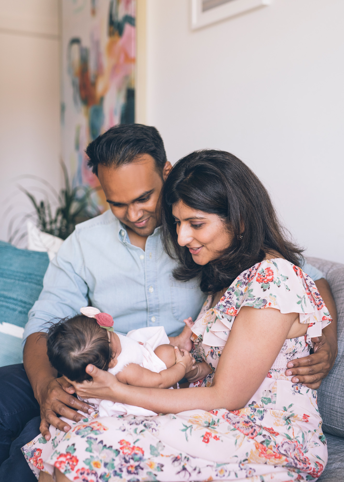 parents-holding-their-baby-girl-in-their-san-francisco-apartment.jpg
