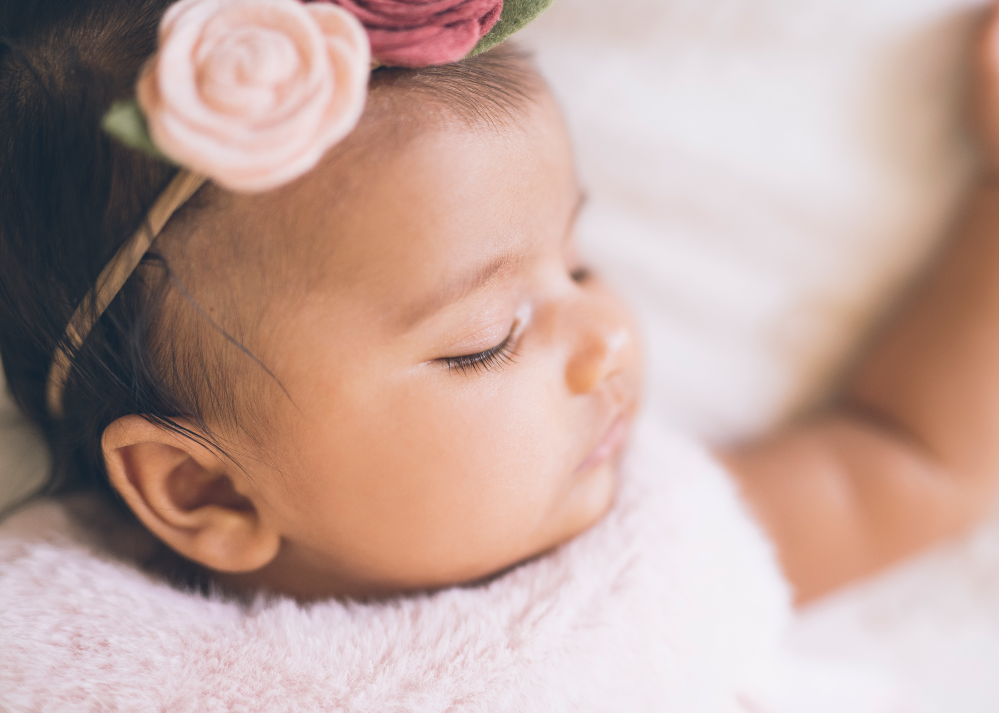 close-up-of-three-month-old-baby-girl-focused-on-long-eyelashes.jpg