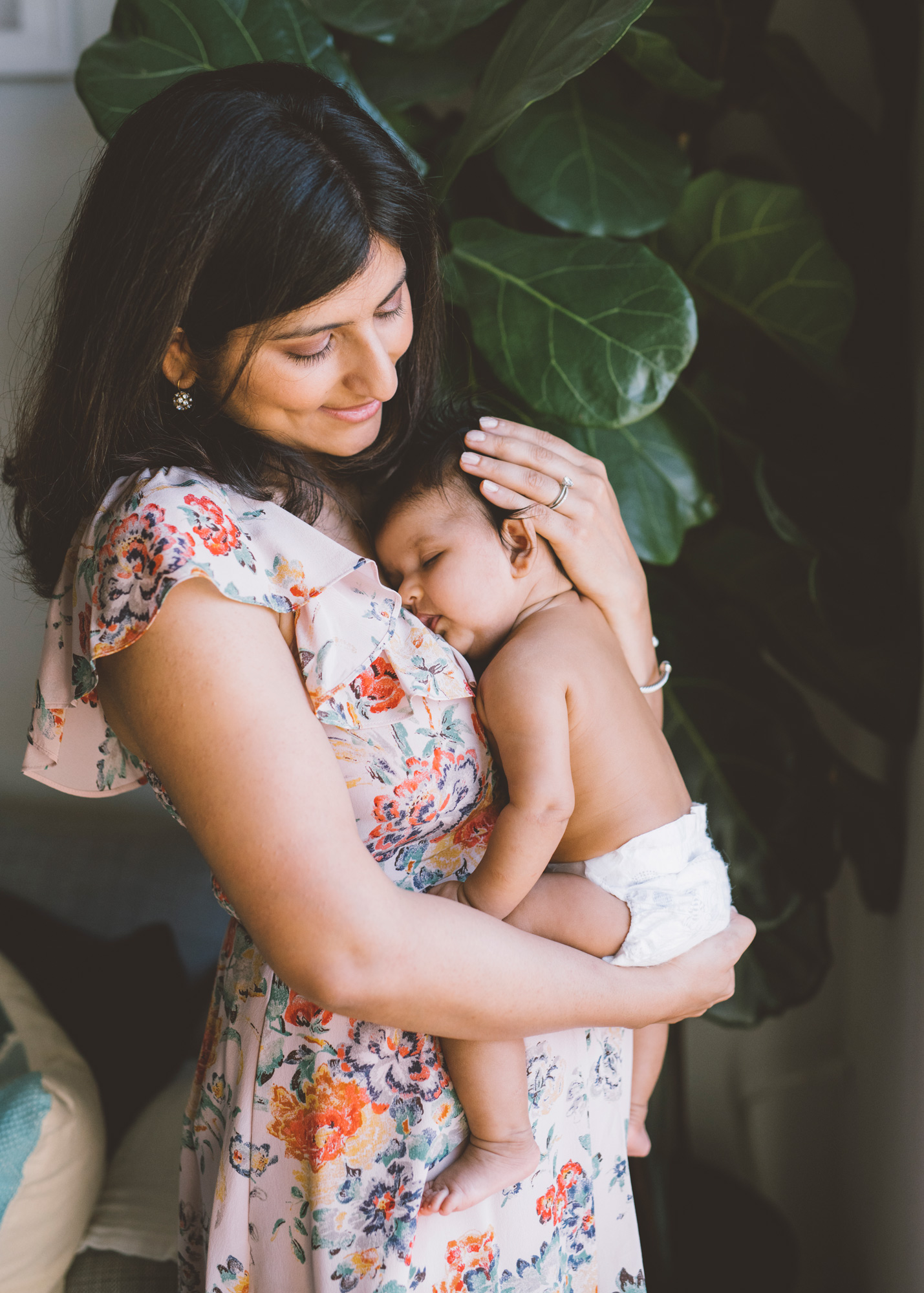 mother-holding-a-sleepy-three-month-old-baby.jpg