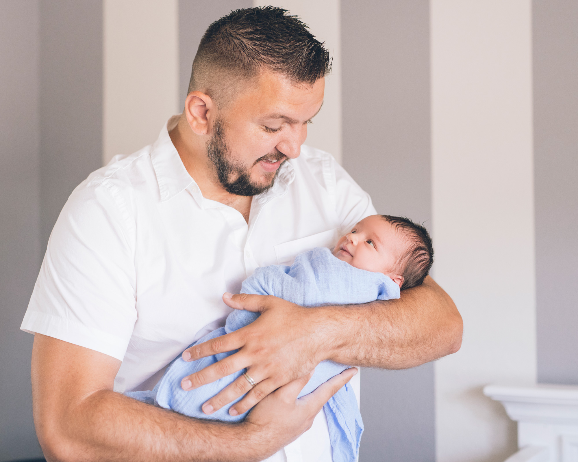 father-holding-smiling-newborn-baby-boy.jpg