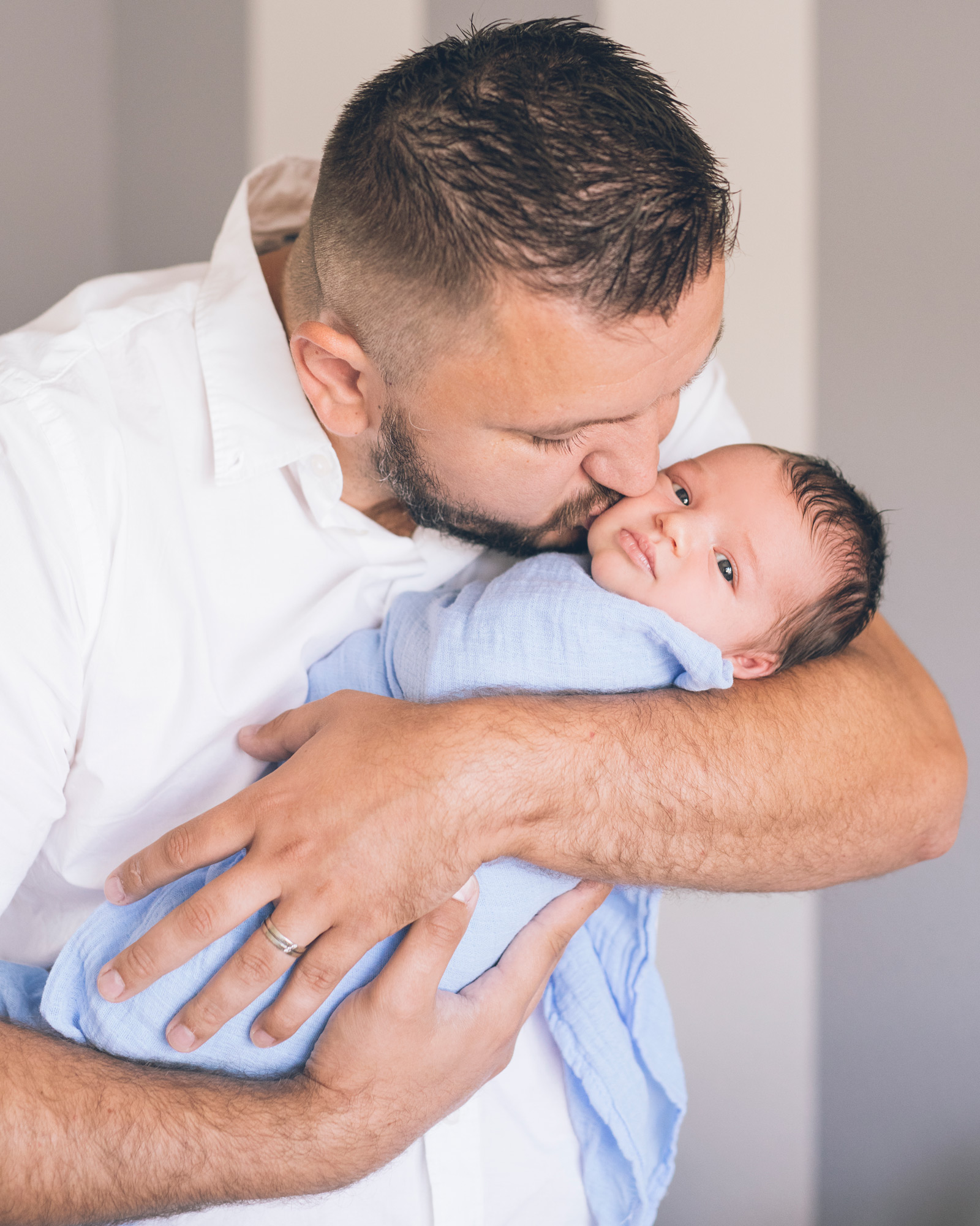 father-holding-and-kissing-his-newborn-baby-boy.jpg