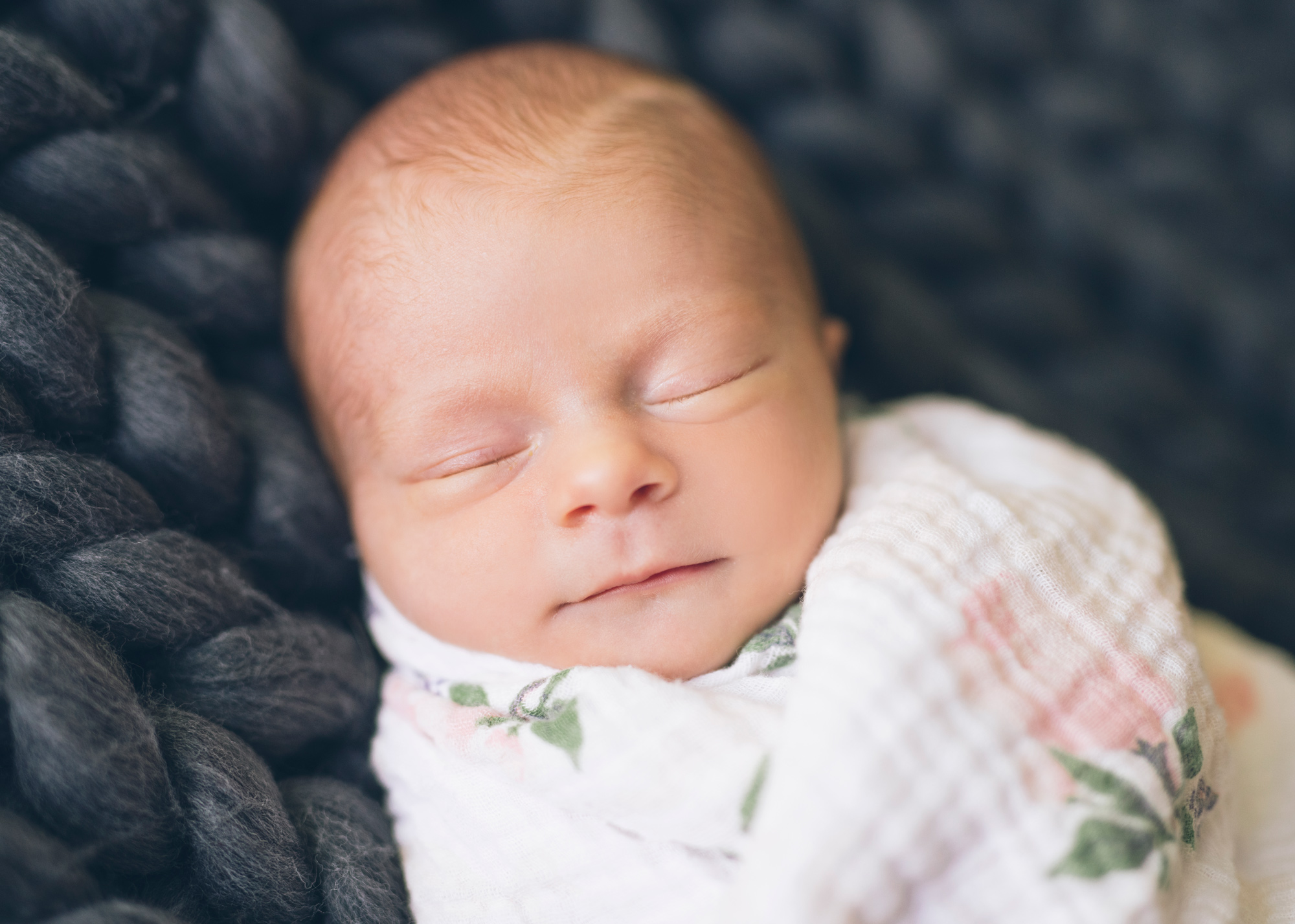 baby-girl-sleeping-on-a-chunky-grey-knit-blanket.jpg