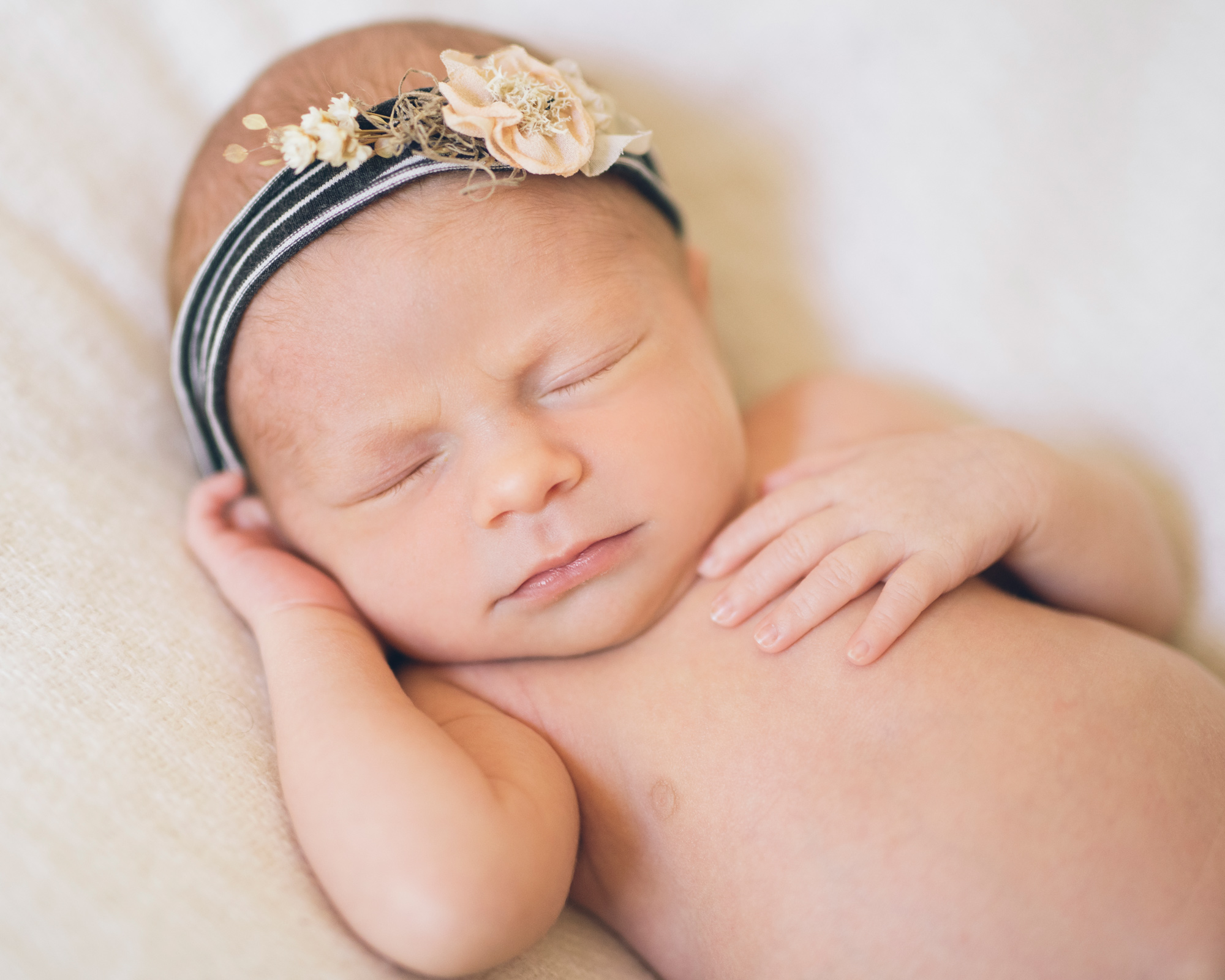 sleeping-newborn-with-a-black-and-white-headband.jpg