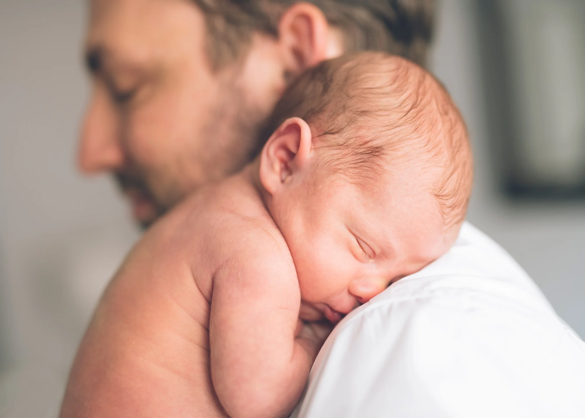 father-and-his-newborn-baby-girl-on-shoulder.jpg