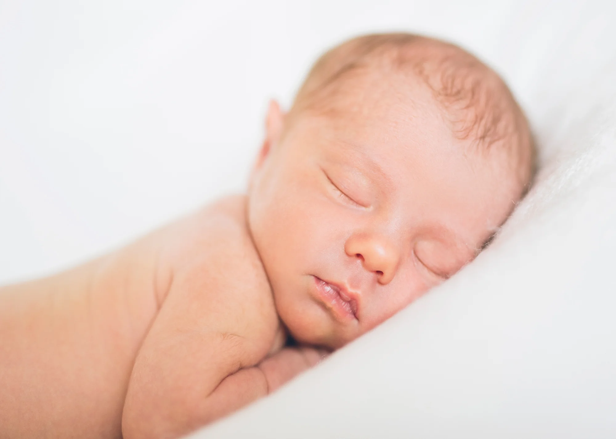 newborn-baby-on-white-blanket.jpg
