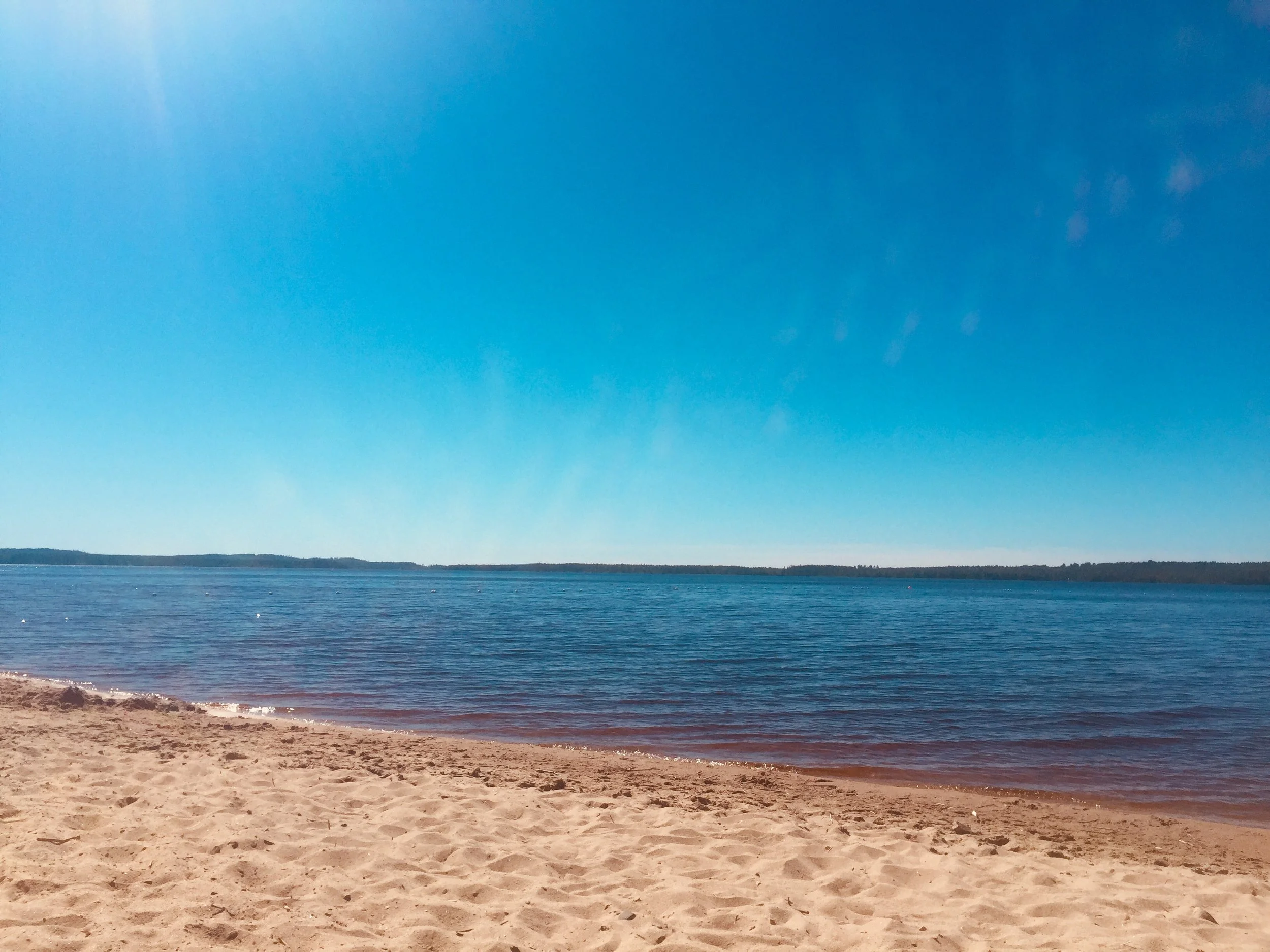 Bildbevis från härlig simstrand i Vuokatti
