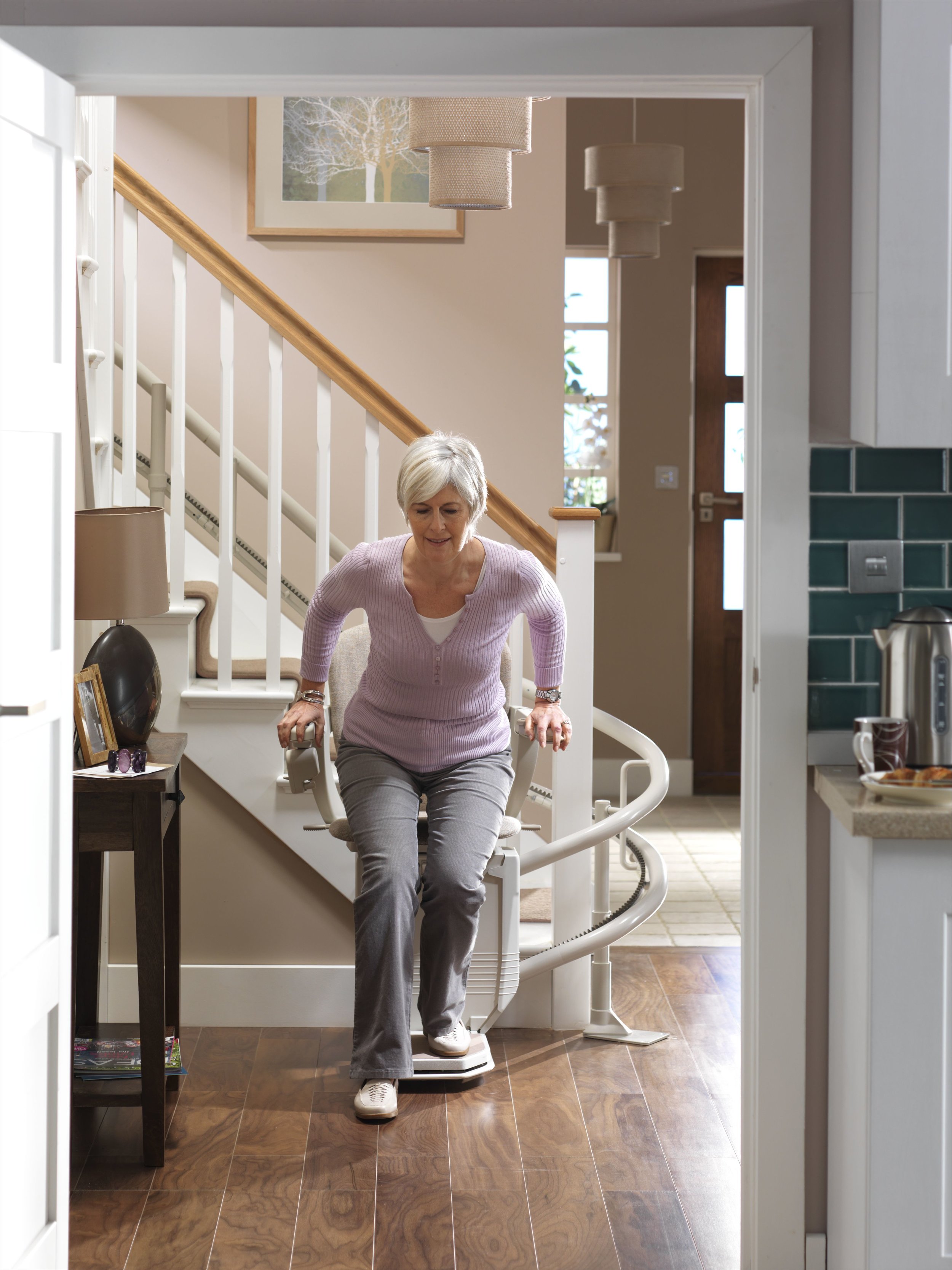Starla-curvedstairlift-model-getting-out-square-on.jpg