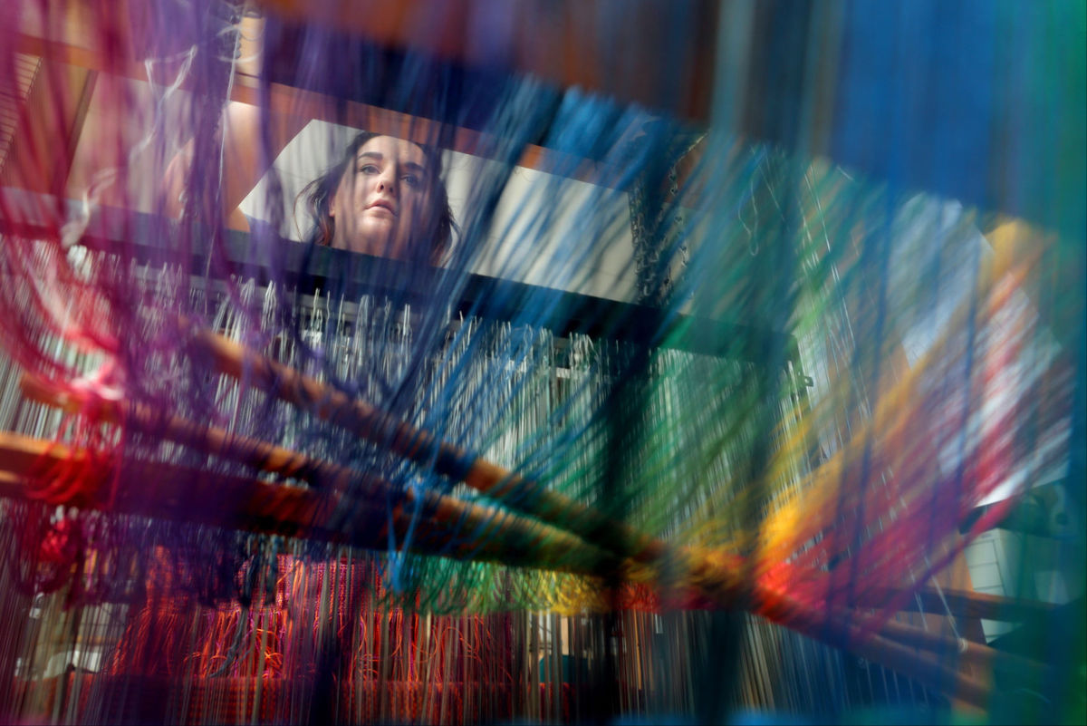M.P. King--State Journal Christie Suchomel, a recent grad of UW-Madison's textile and fashion design program from Sun Prairie works in the Weaving Lab set up at the Wisconsin Institutes for Discovery for the summer by Marianne Fairbanks. 