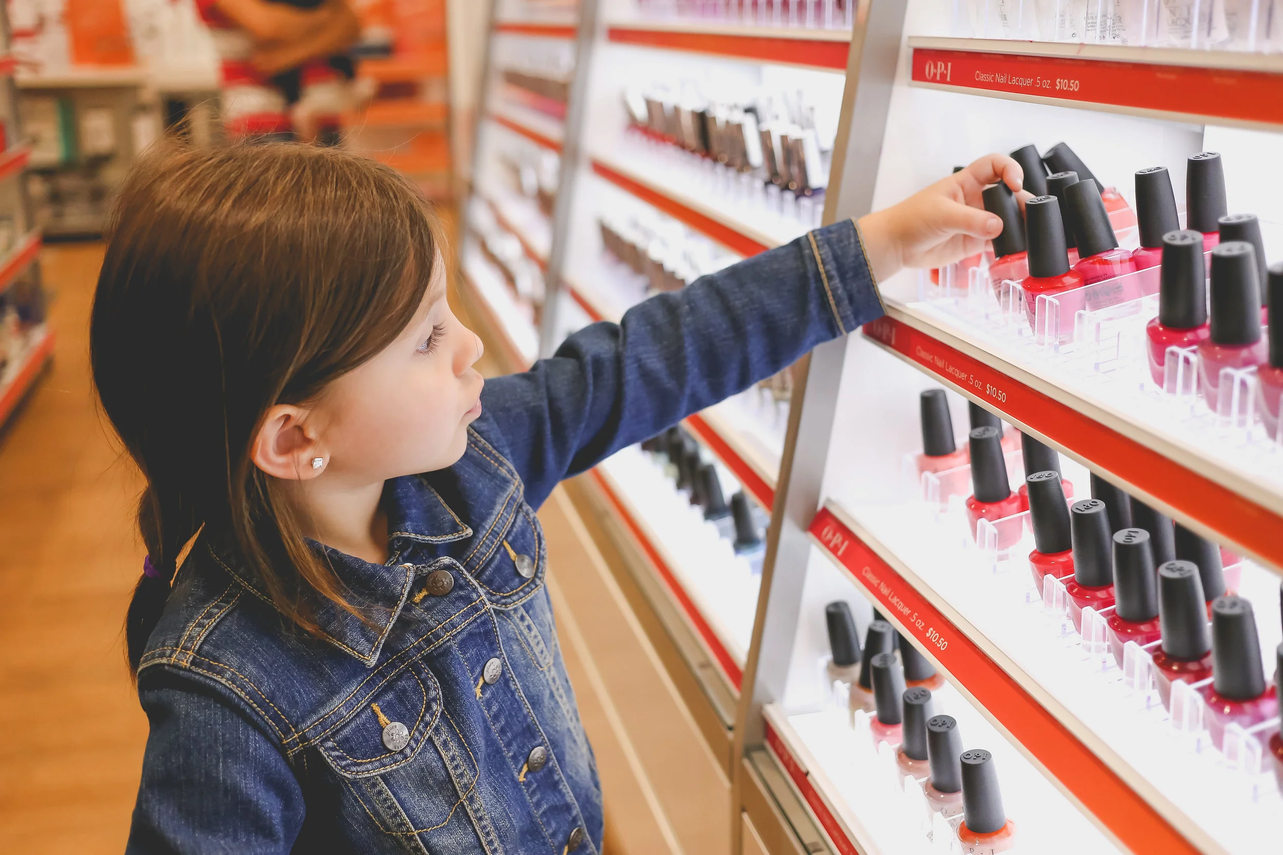 Little girl shopping for nail polish at Ulta beauty supply in Staten Island, NY. Day in the Life Family Photography.