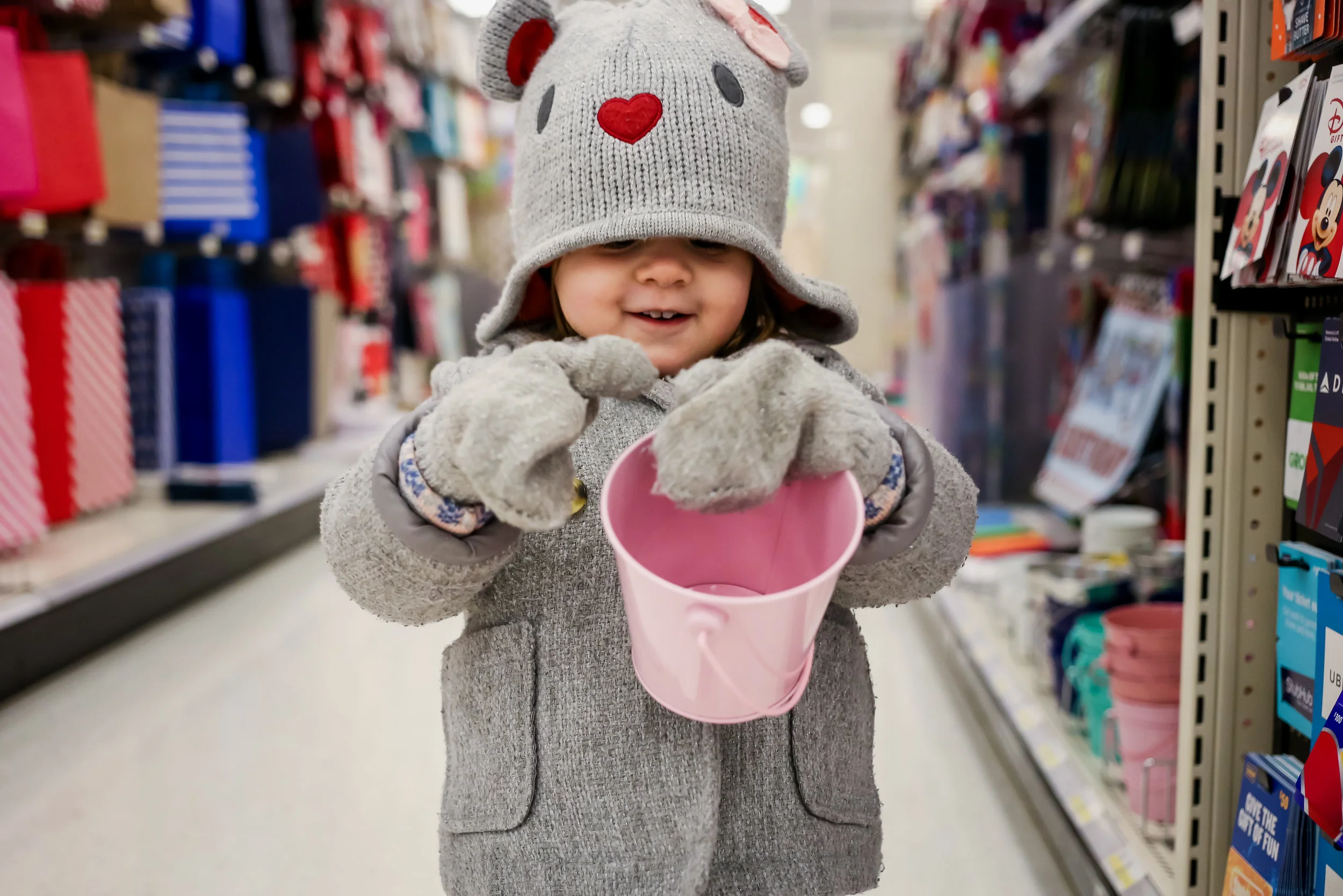 Young girl with pink bucket at Target.