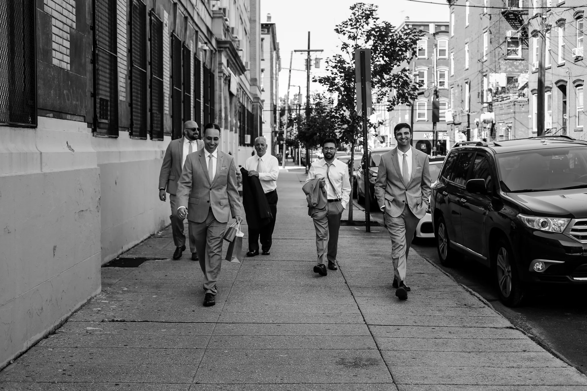 Groomsman walking toward the ceremony, photo by Jen Grima, Lehigh Valley Wedding Photographer.