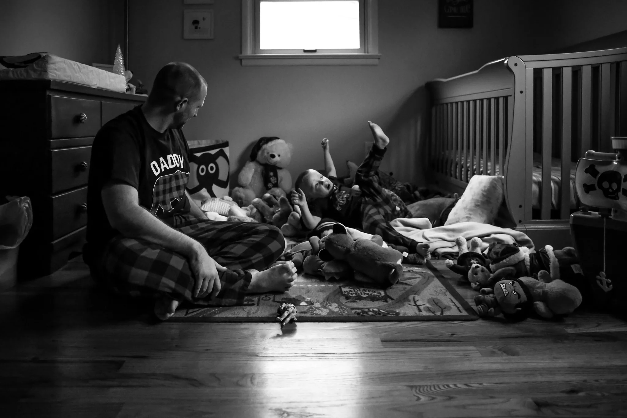 Father and son playing at home during a family photography session in Emmaus, PA.