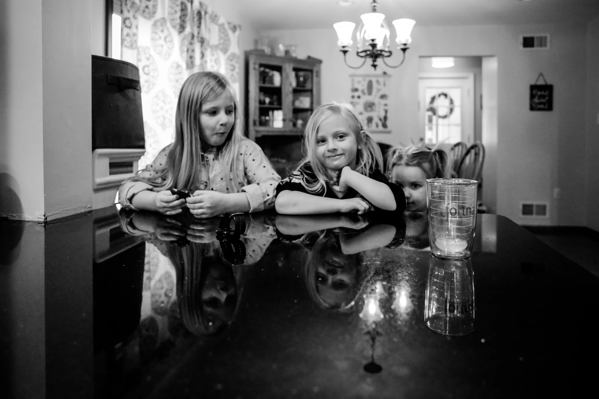 Sisters hanging out in the kitchen during their at home family photography session in Fogelsville, PA.