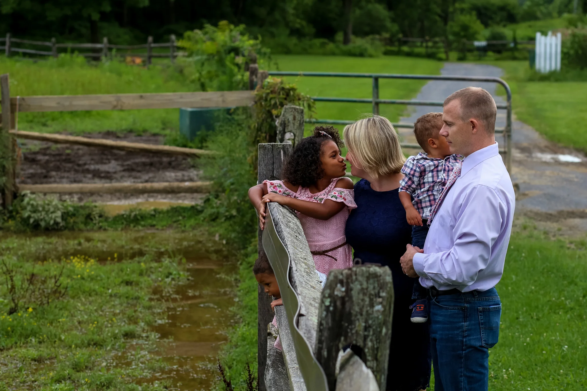 Sweet mother daughter moment during a family photography session at a horse farm in Allentown, PA.