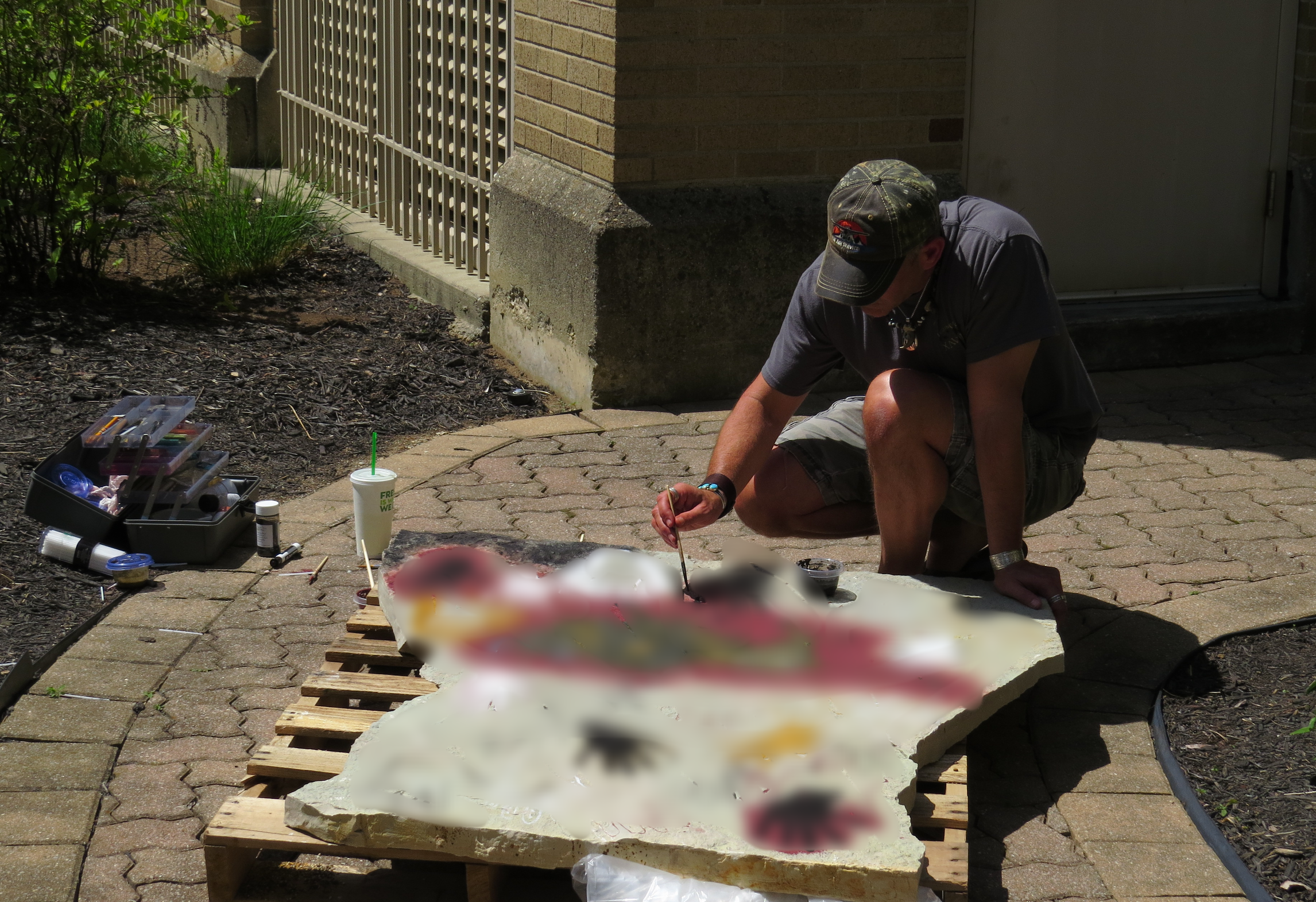 IDENTITY. 380lb, 5'x5' flagstone mantle piece, 30 students contributed. Red and Yellow Ochre, Charcoal, Animal Bone and Zinc Oxide pigments. In the Aging process. 