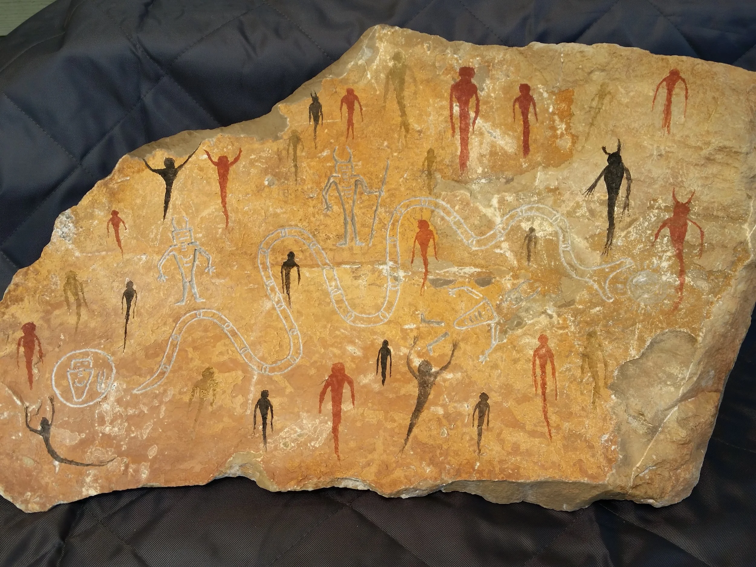 FOURTH DAY VISION, Carved Teton metamorphic rock table piece with red and yellow ochres and animal bone pigment. 60lbs. Aged, then weather treated. $200