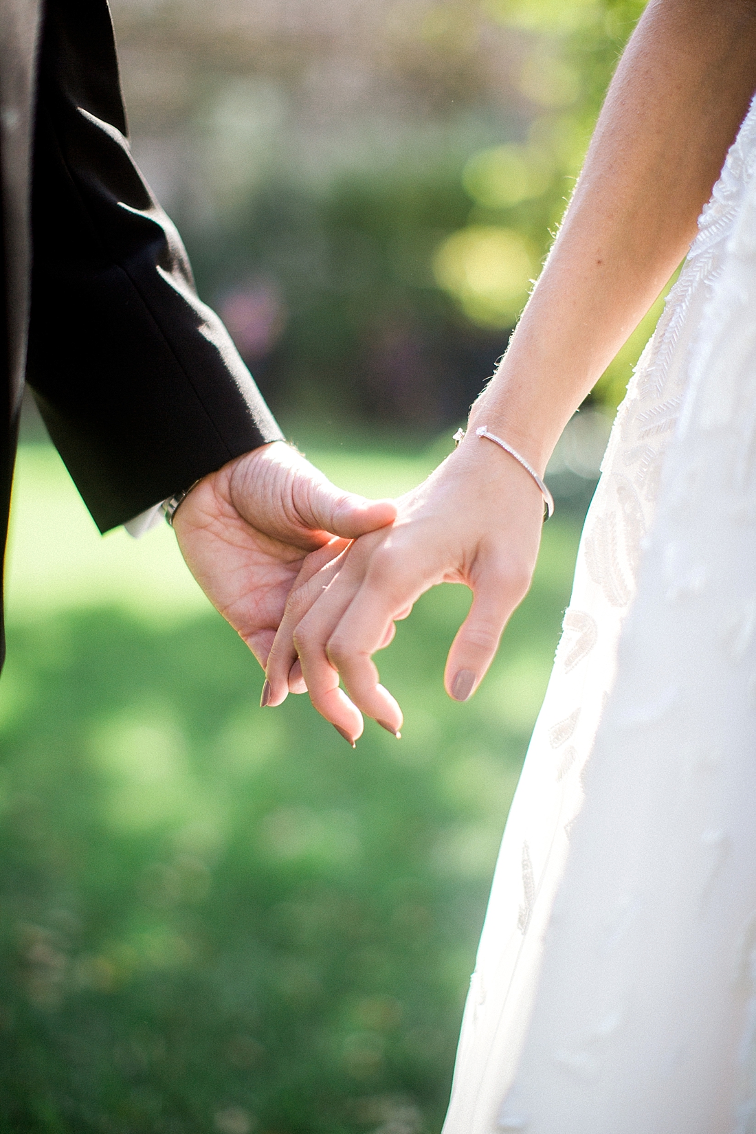 couple holding hands 