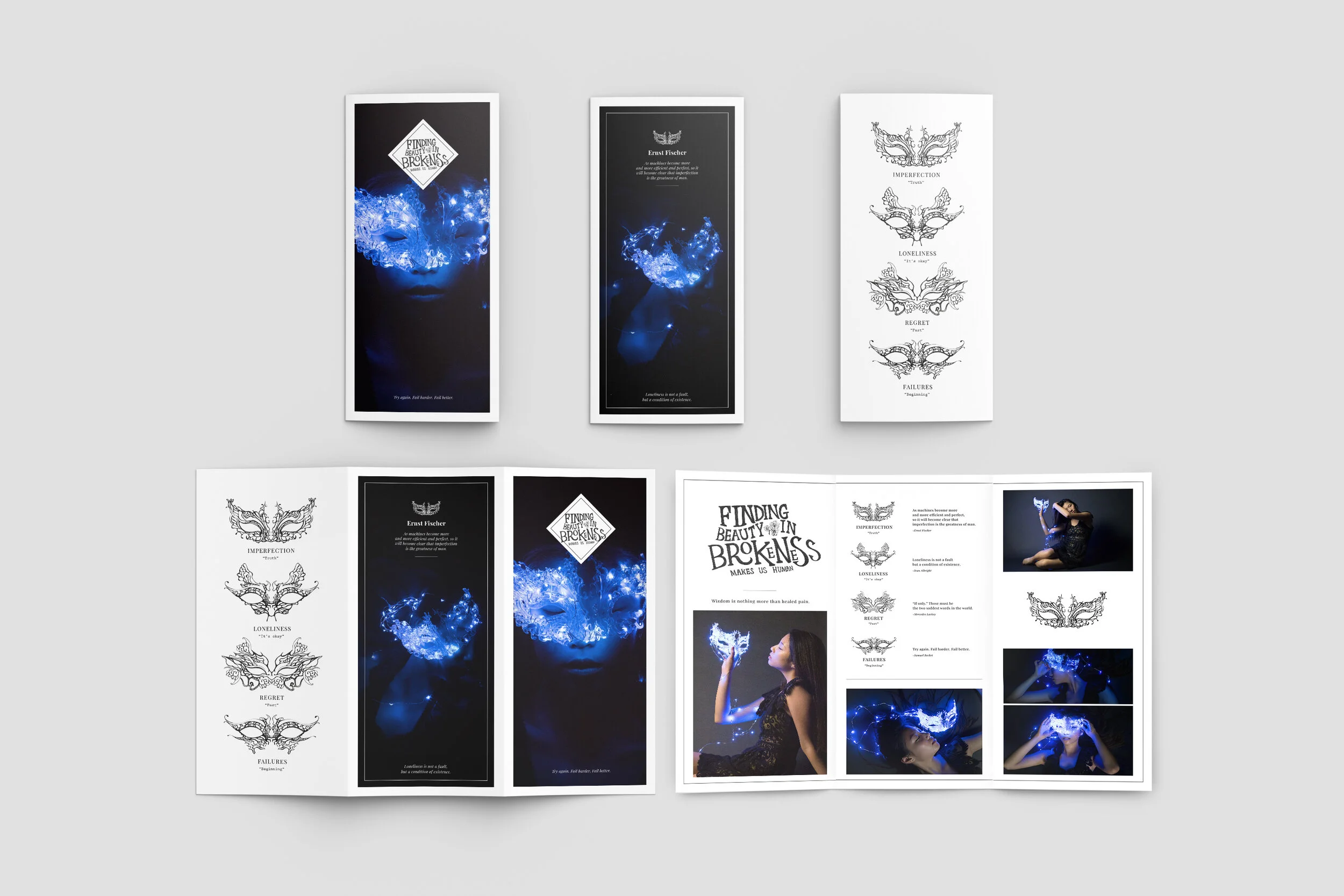 Three vertical display panels with black and white artwork and blue-lit images. The panels include text about emotions and human experiences, with images of blue masks and a woman holding a light-up object.