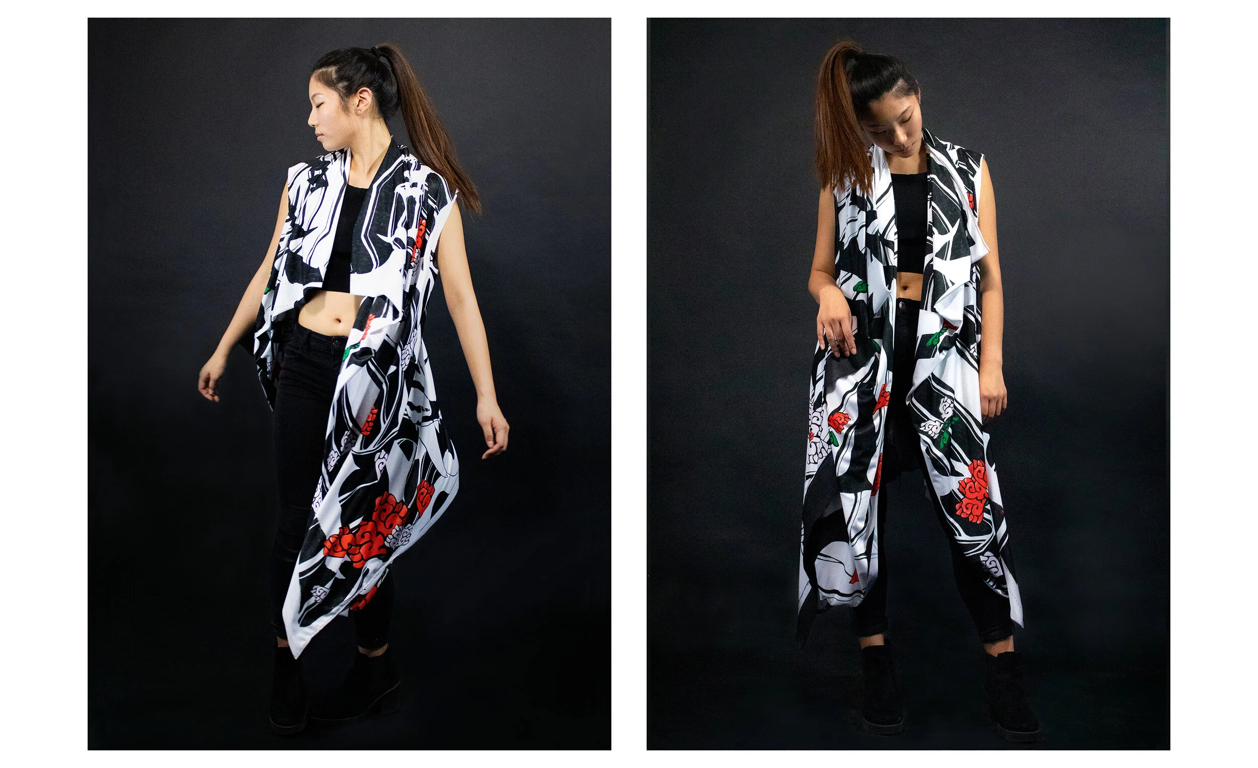 Two young women with long hair tied in high ponytails, wearing sleeveless patterned black and white tops with red and green floral designs, black pants, and black shoes, standing against a black background. They are looking down with a relaxed postur
