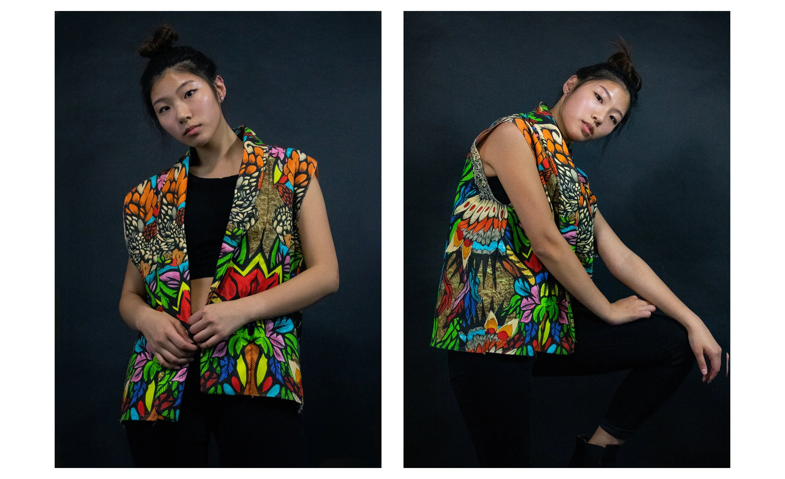 A young woman with a top bun hairstyle wearing a colorful, butterfly and floral patterned vest over a black top and black pants, shown in two poses against a dark background.
