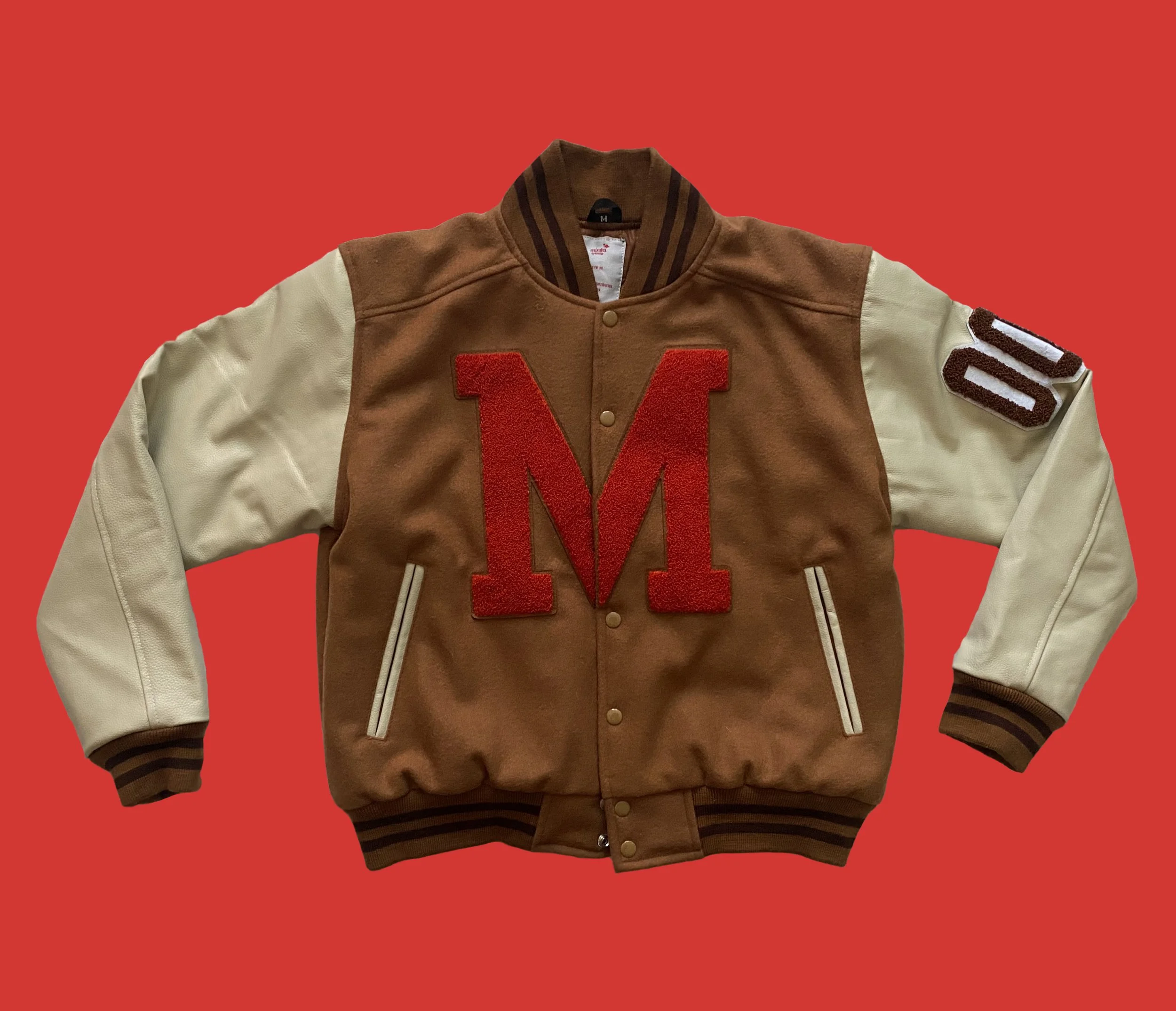 brown and orange varsity jacket