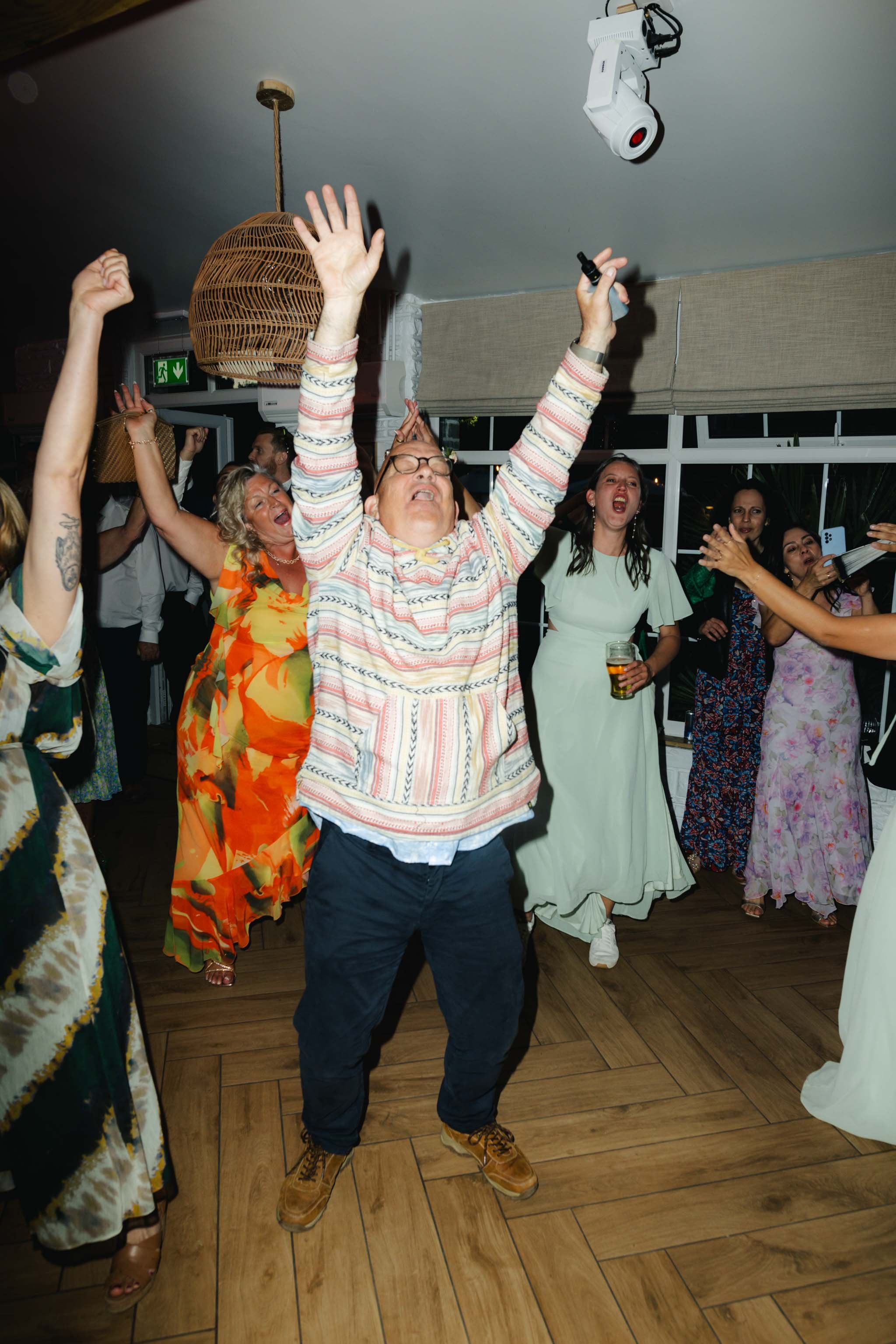 Wedding guests dancing at Watermouth Cove