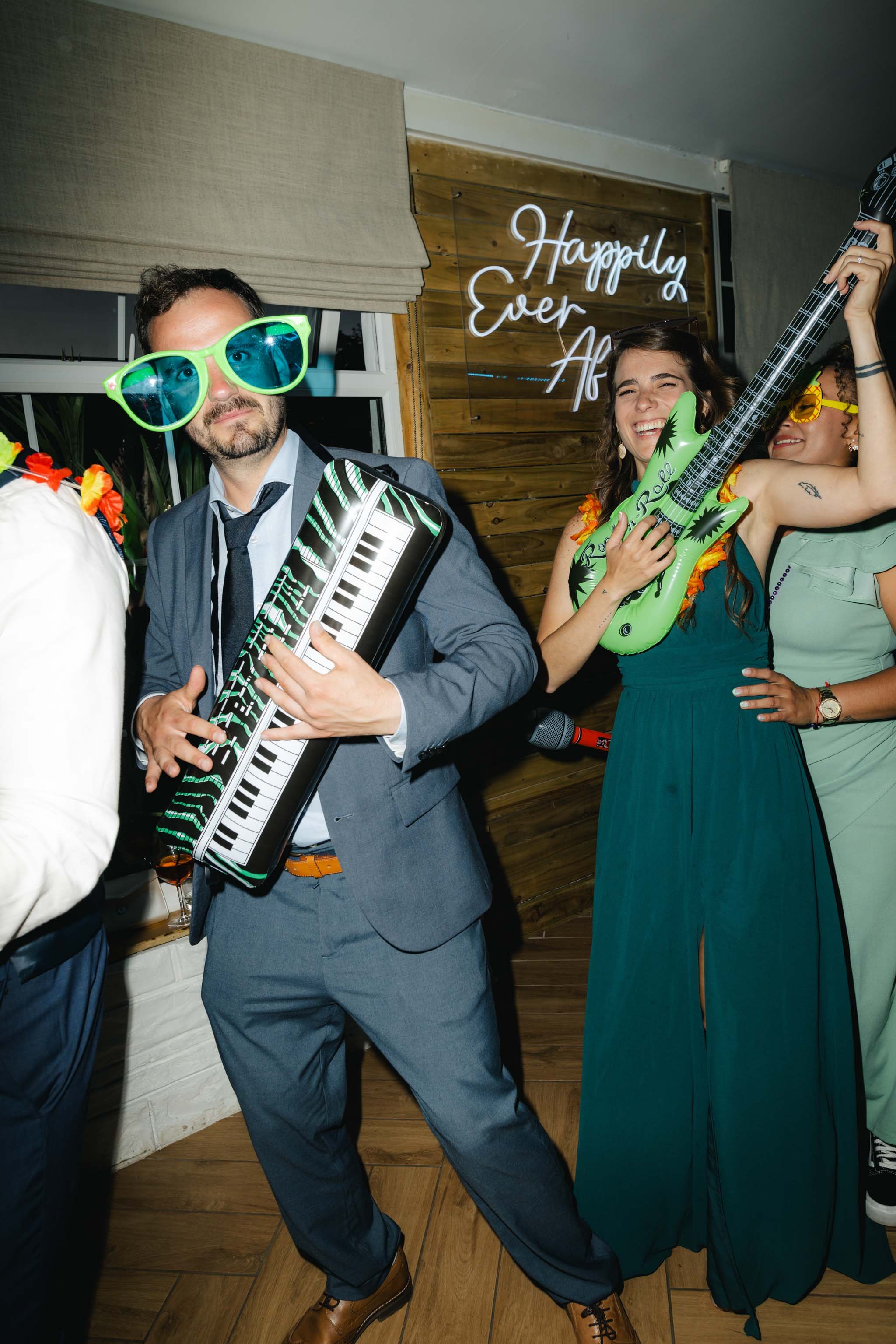 Wedding guests playing with props on the dancefloor at Watermouth Cove Weddings