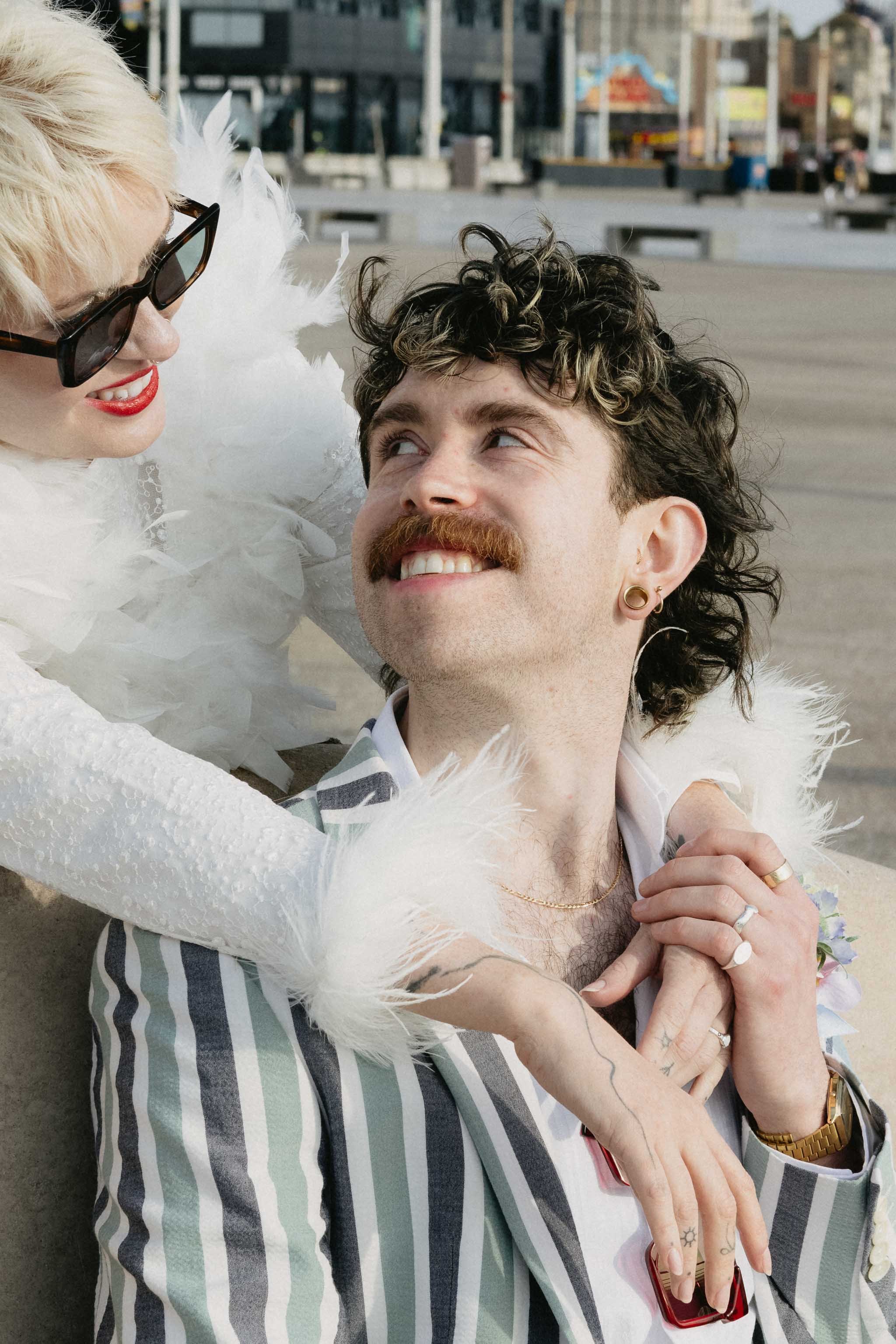 Groom and bride laughing naturally during a documentary-style wedding shoot