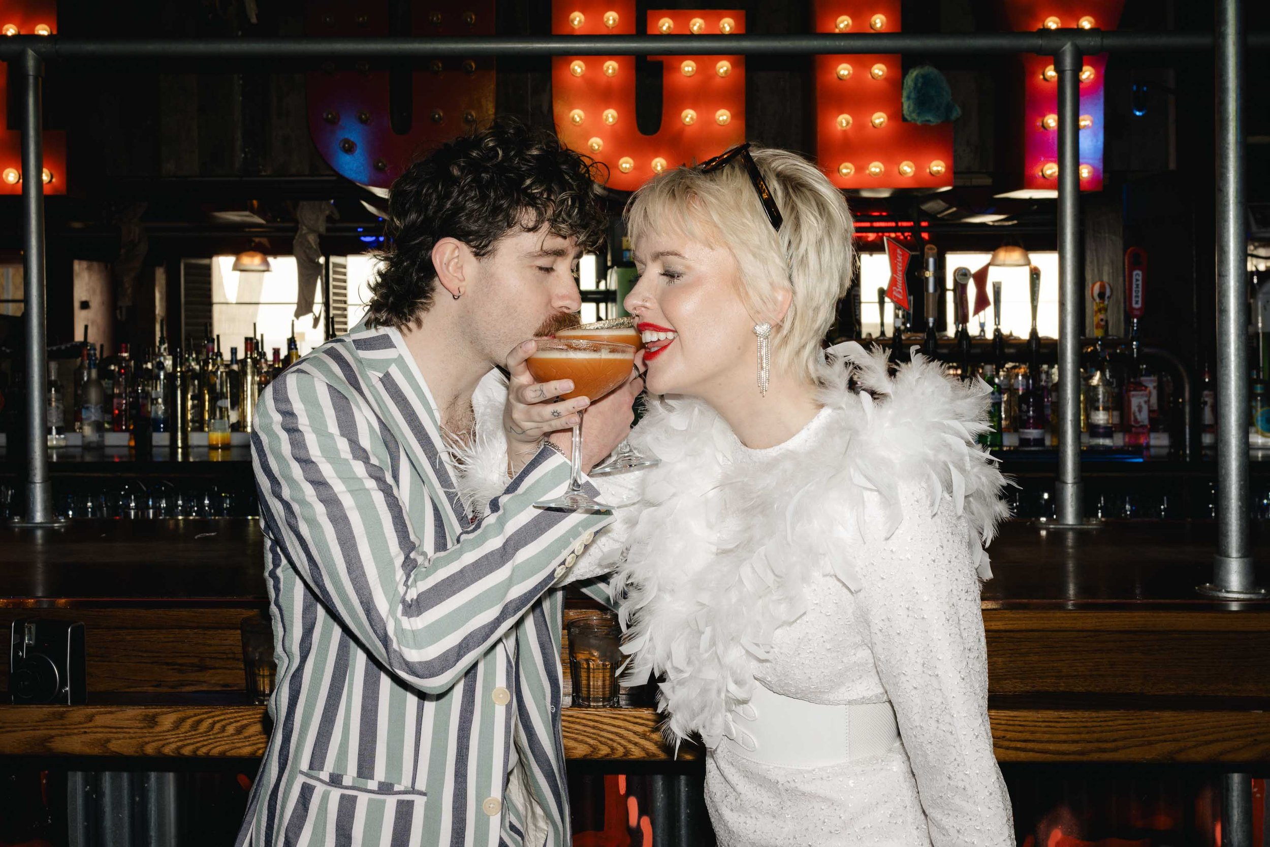 Newlywed couple sharing cocktails after a micro wedding in Blackpool