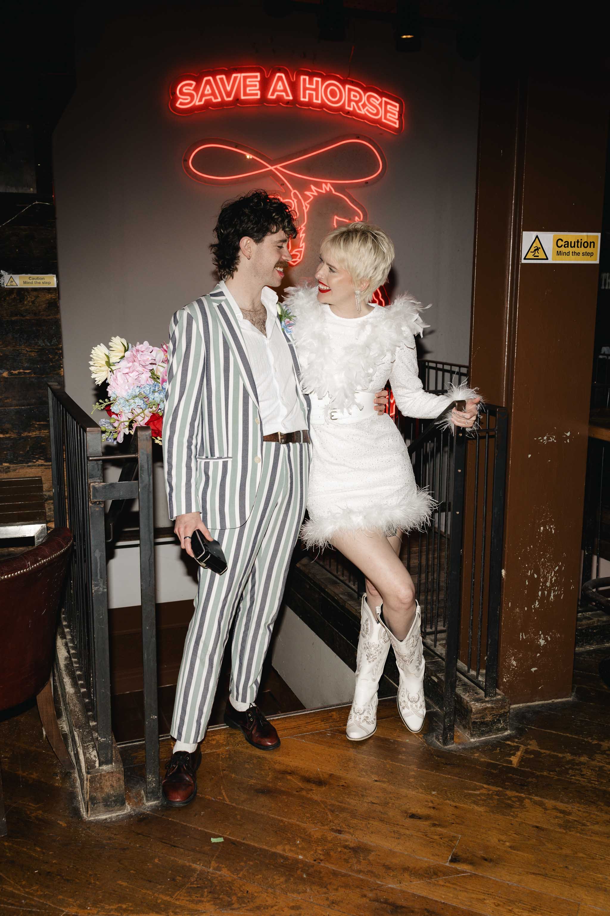 Bride and groom laughing naturally in a bar in Blackpool