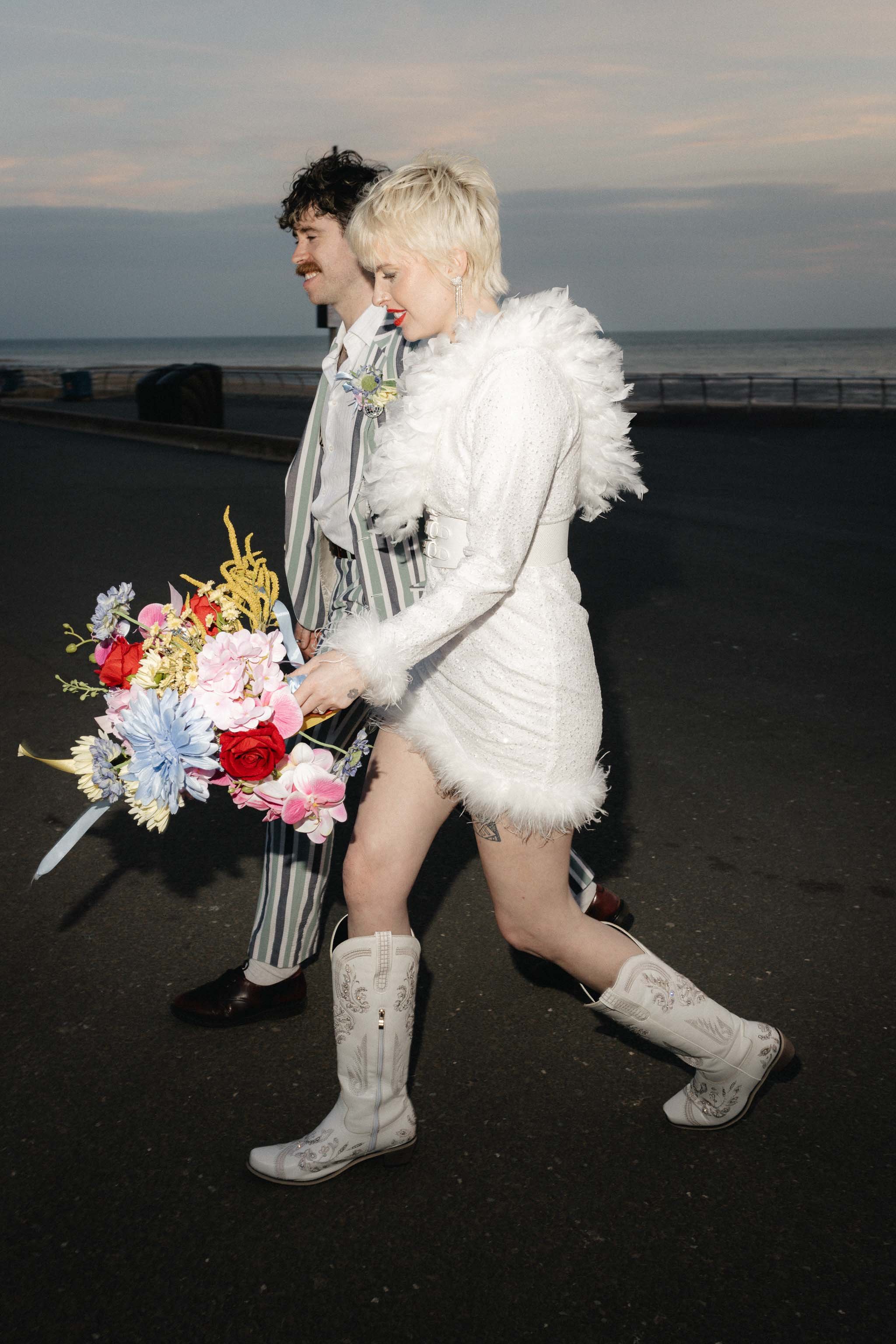 Editorial style photo of a couple walking paparazzi style
