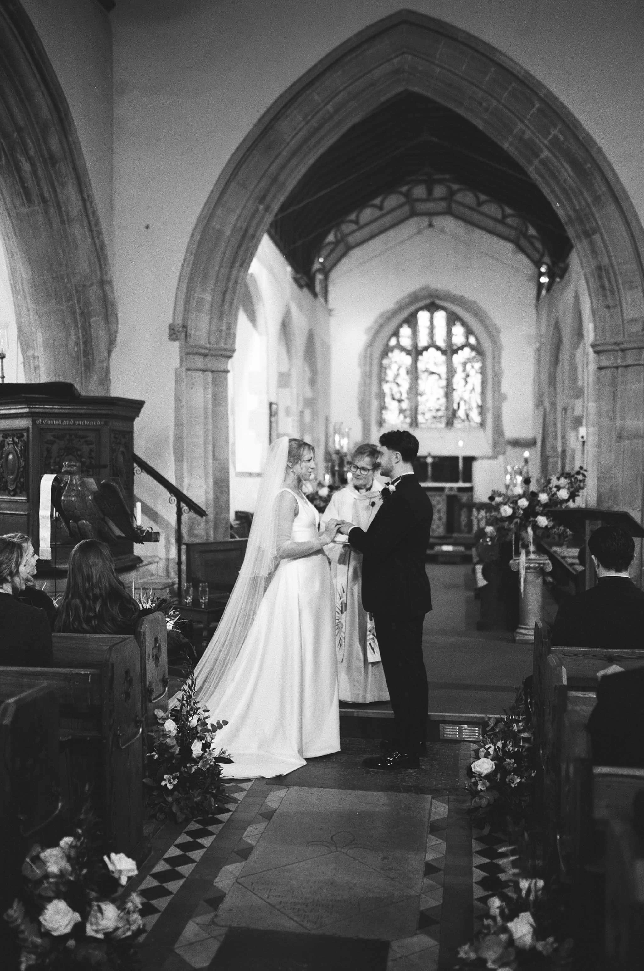  Wedding couple saying their vows during a church ceremony. 