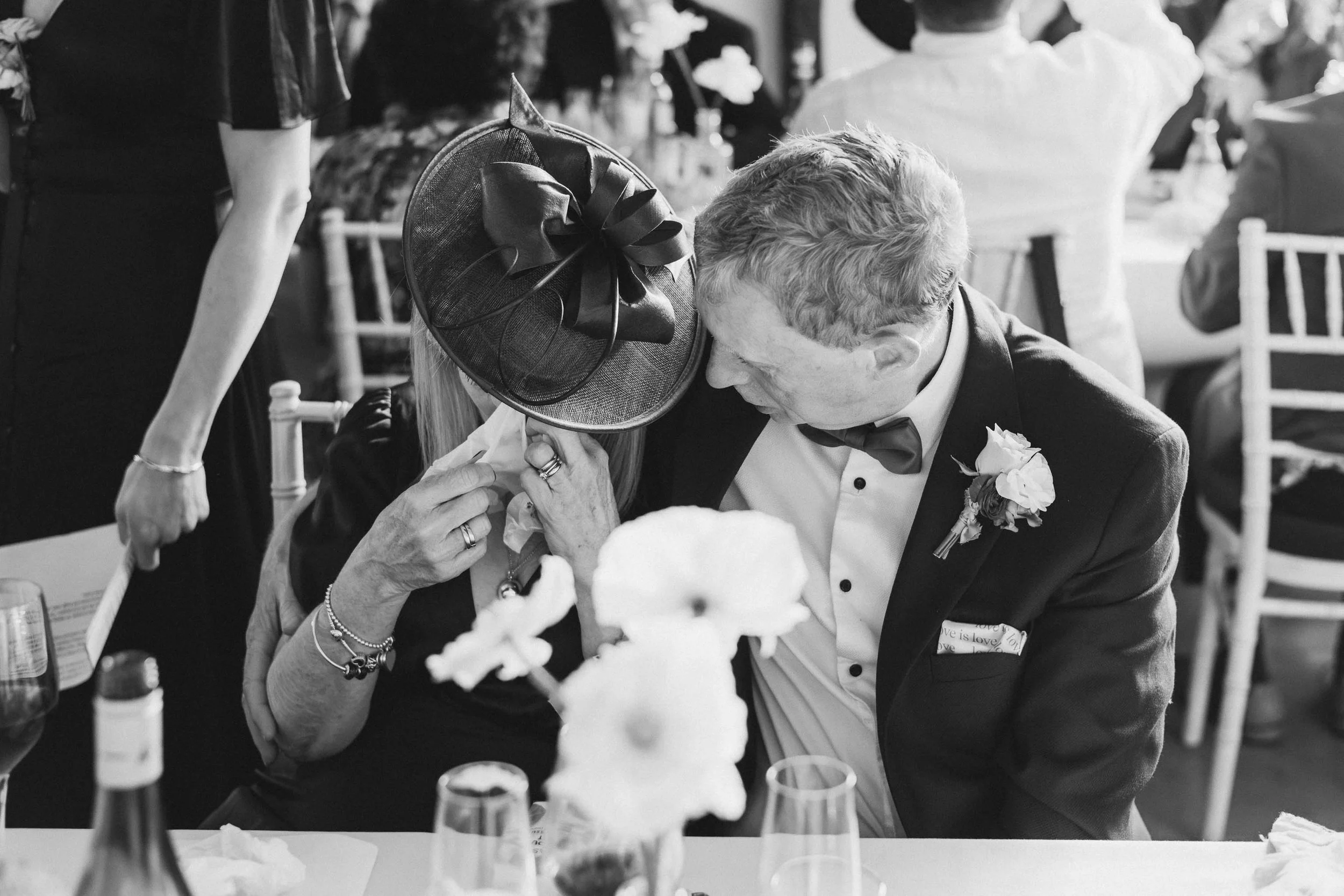  Documentary wedding photo of a woman crying during speeches. 