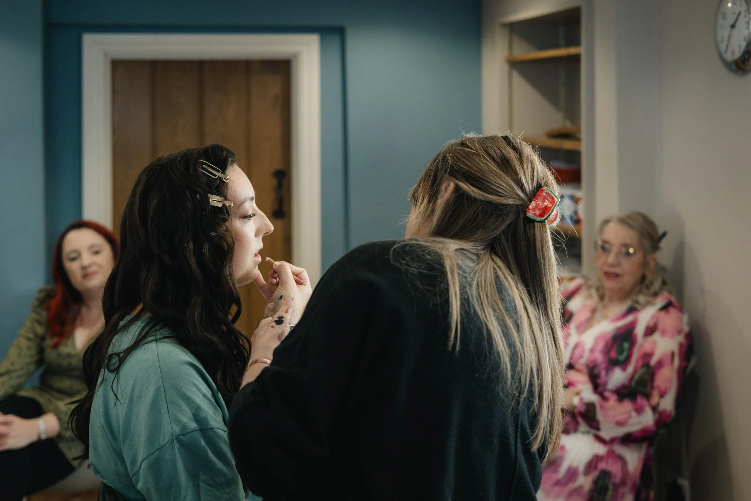  Jess getting ready at home for Worcester wedding with makeup by Helen Shakespeare.   